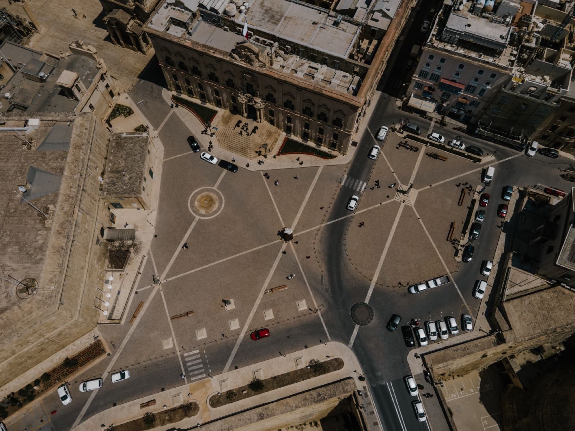 Drone shot capturing a historic city square in Valletta, Malta showcasing urban architecture.