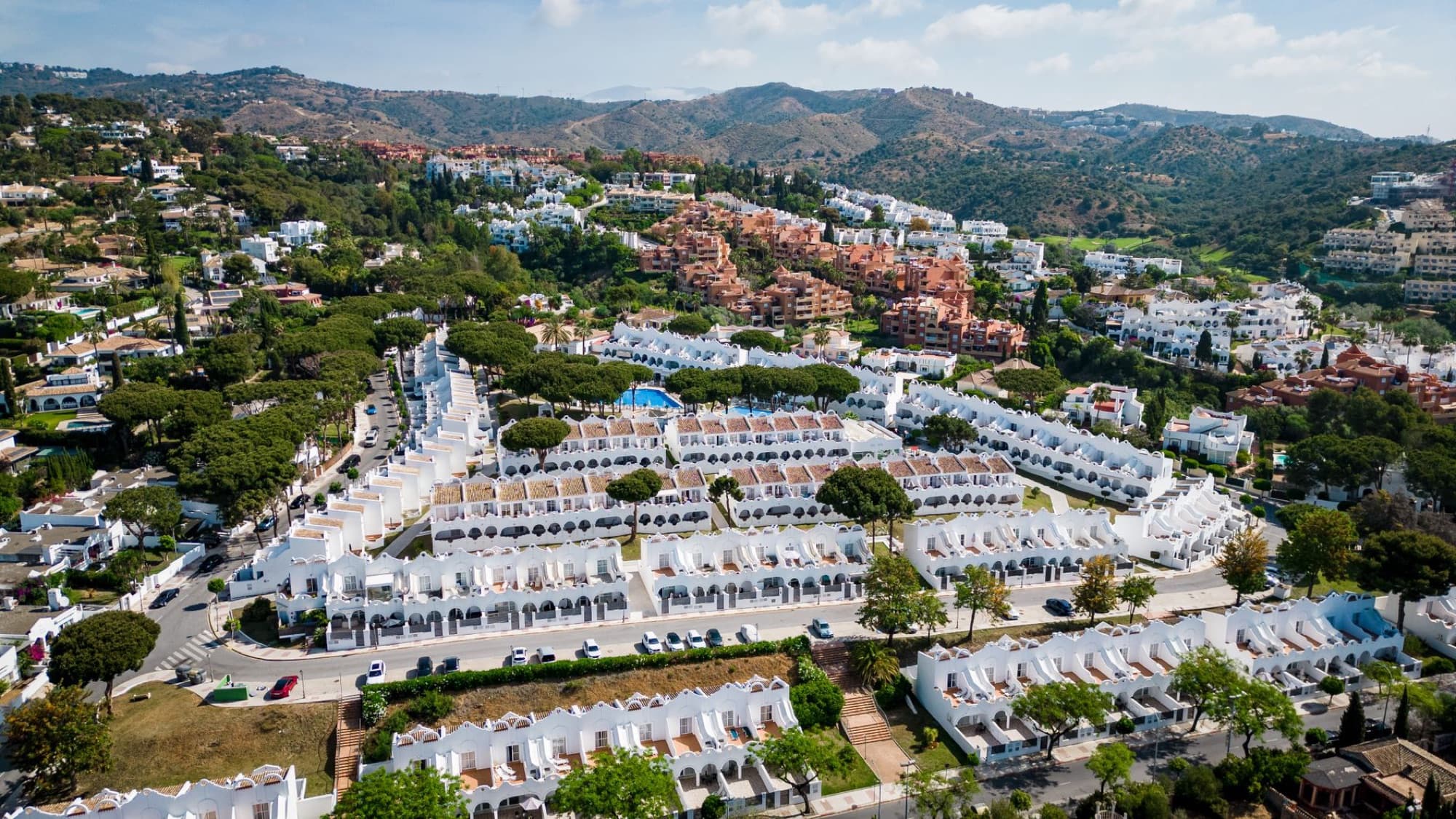 Stunning aerial view of Marbella showcasing vibrant residential areas and landscape.