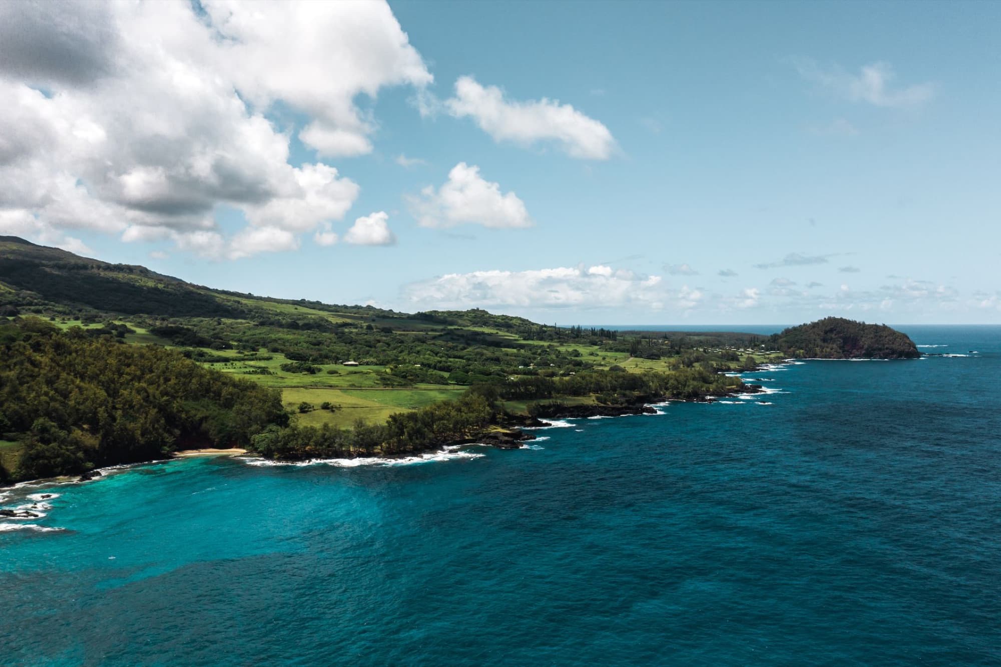 A breathtaking aerial view of the lush green coastline near Hana, Maui, Hawaii.