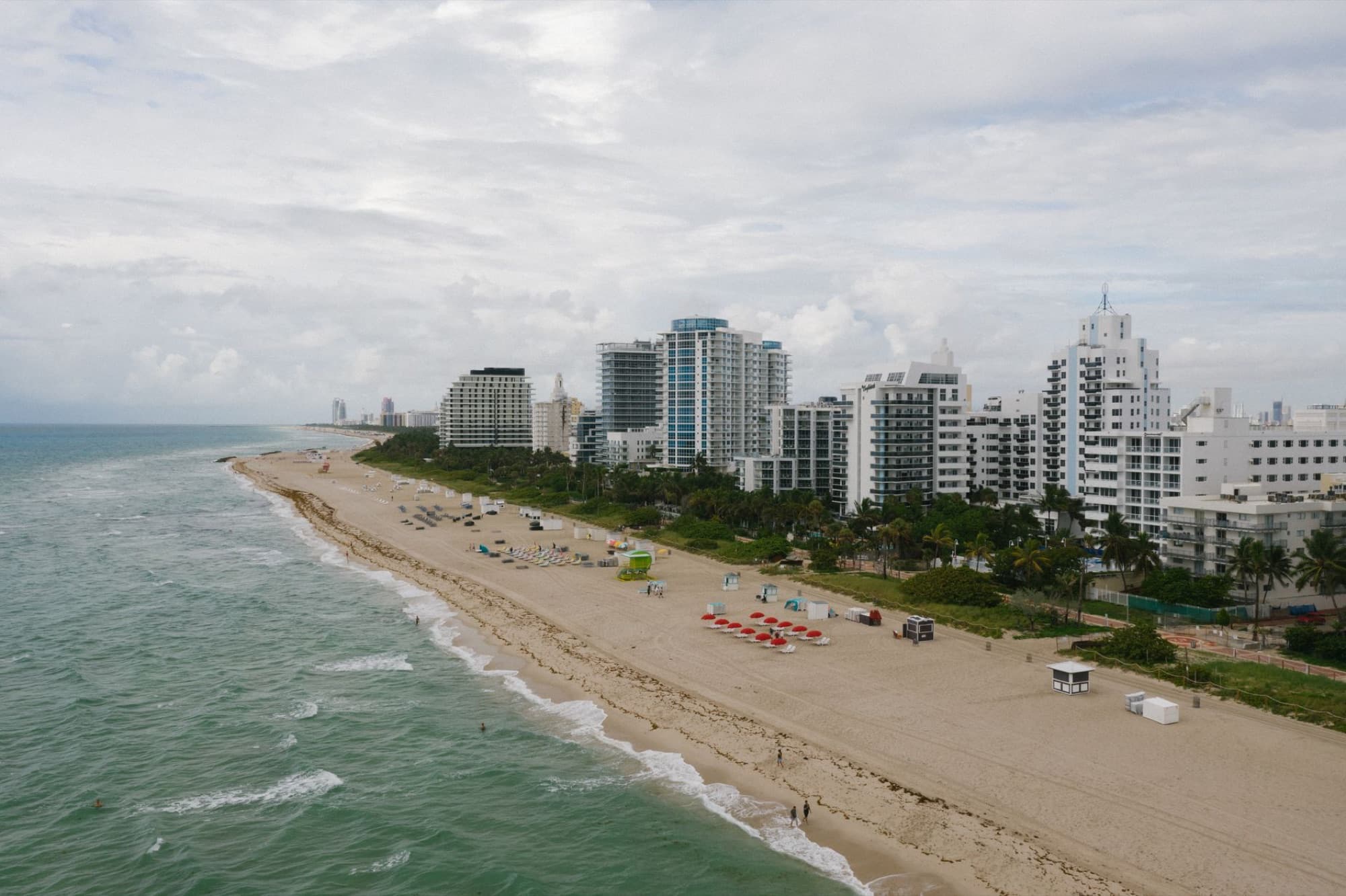 Explore the beautiful Miami Beach coastline with high-rise buildings in this stunning aerial photo.