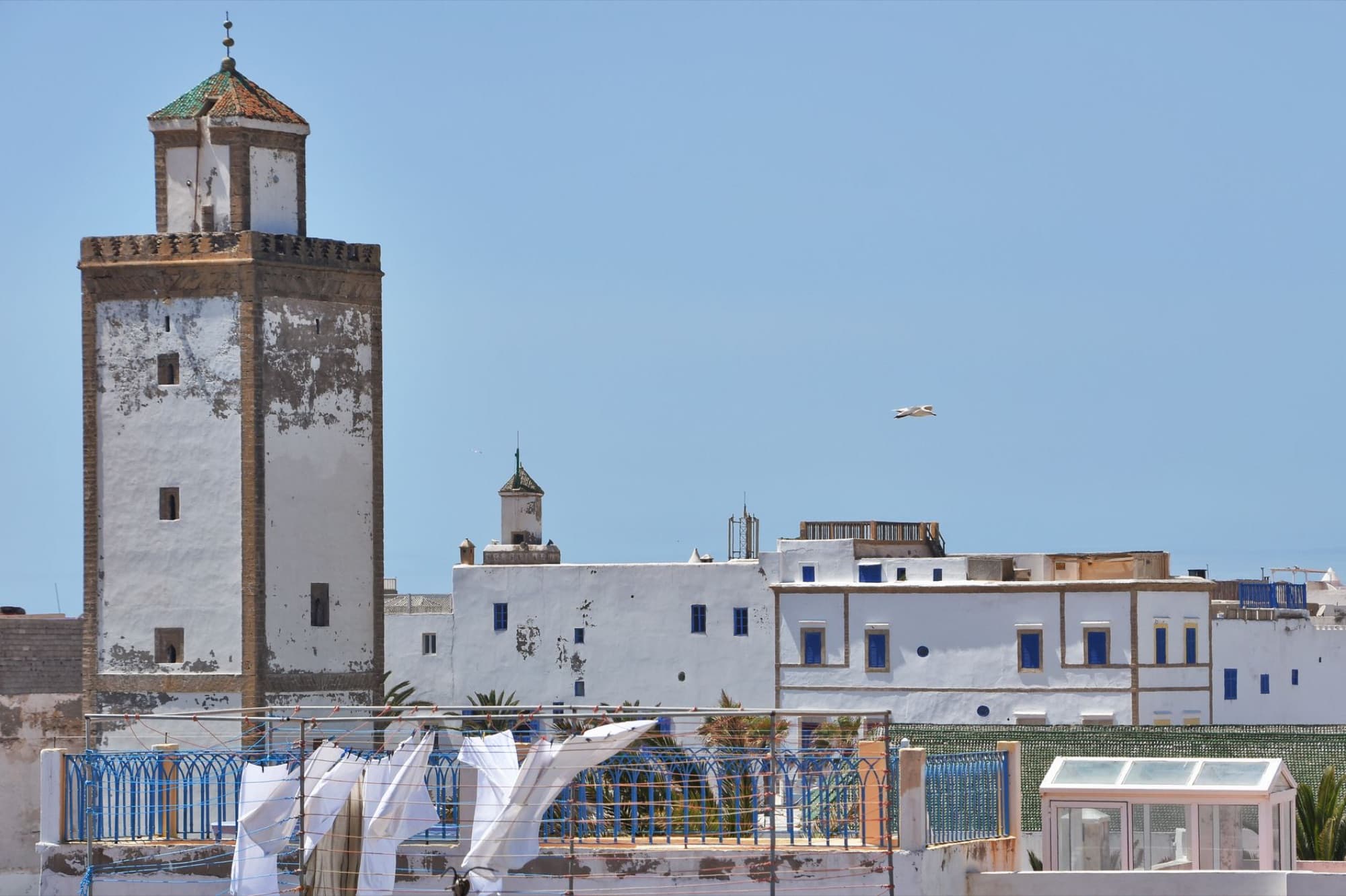 Scenic view of historic architecture and coastal fortress walls in Essaouira, Morocco.