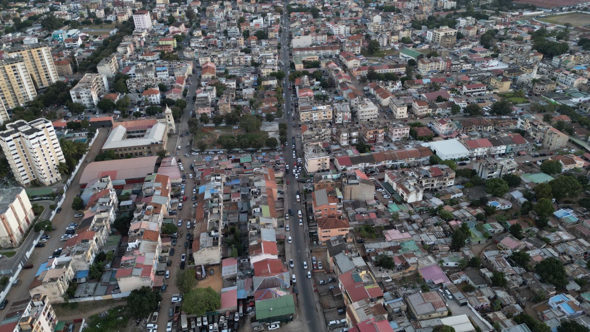 High-angle aerial view of urban landscape in Maputo, Mozambique, showcasing dense city buildings and streets.