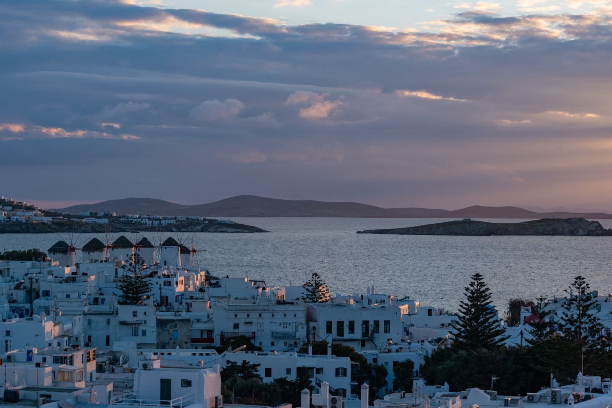 Beautiful view of Mykonos town and sea at sunset, capturing the essence of Greece.