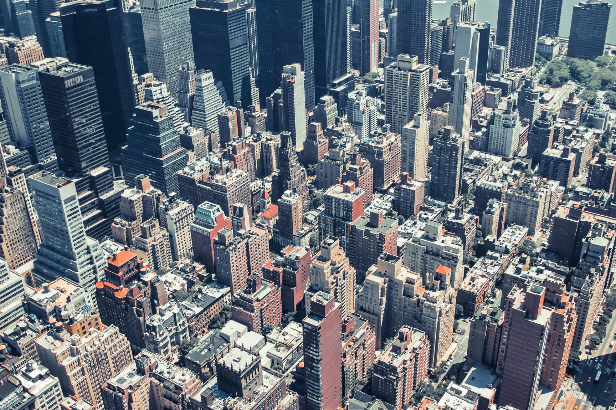 Aerial view showcasing the dense urban landscape of New York City skyscrapers.