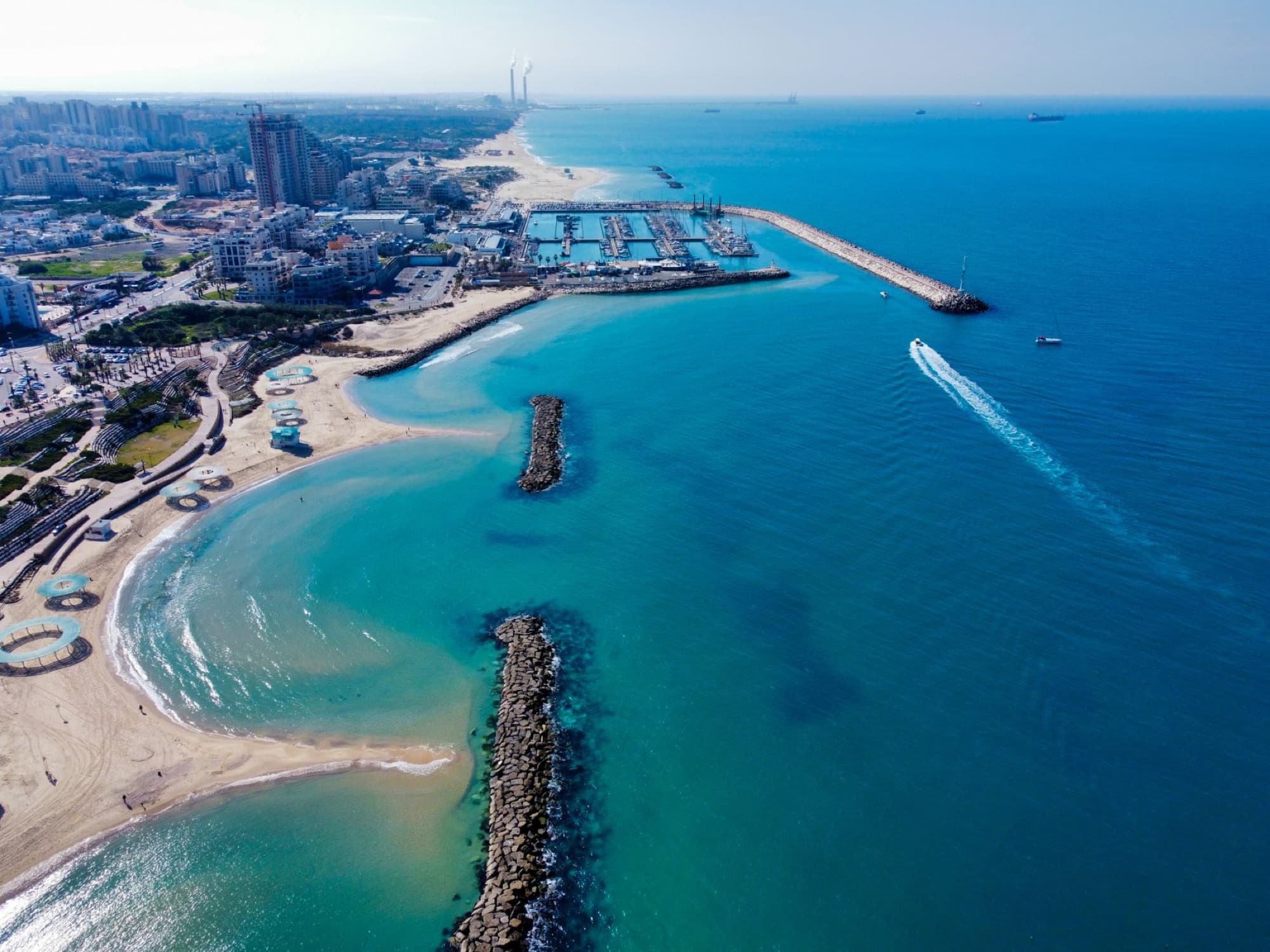 Stunning aerial view of Tel Aviv skyline and beach, showcasing vibrant city and coastline.