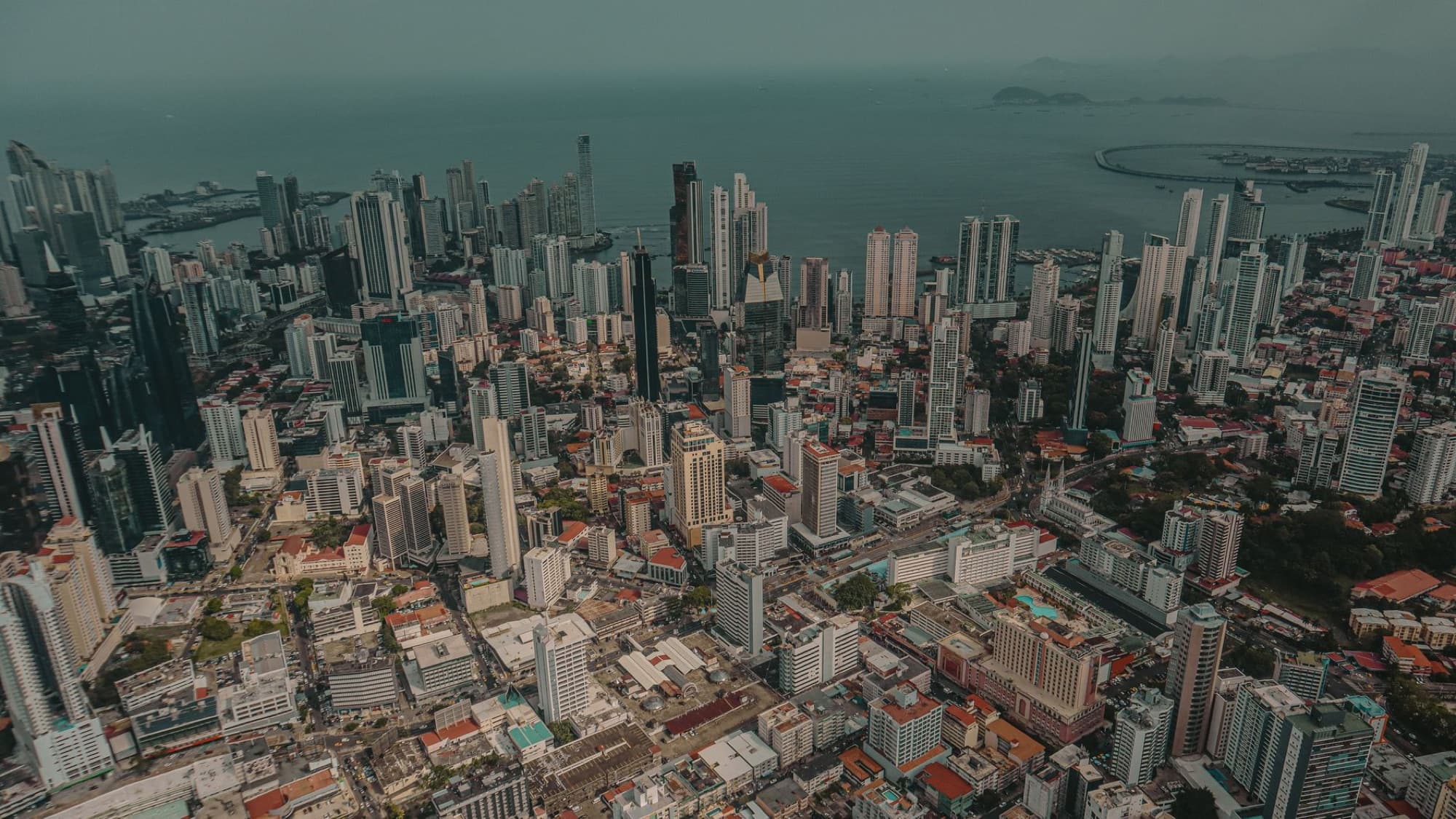 Stunning aerial view of Panama City's modern skyline near the ocean.