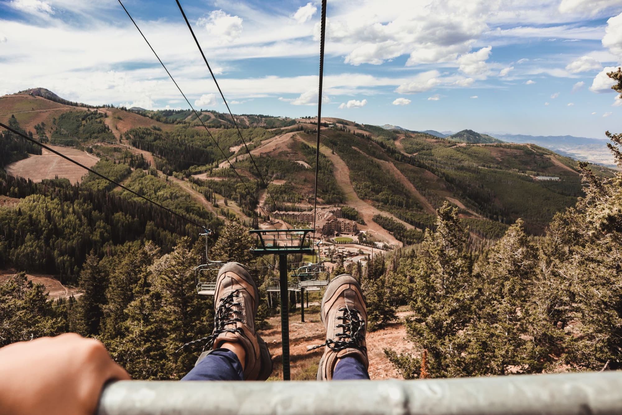 Experience the scenic views of Park City from a cable car ride, capturing nature and excitement.