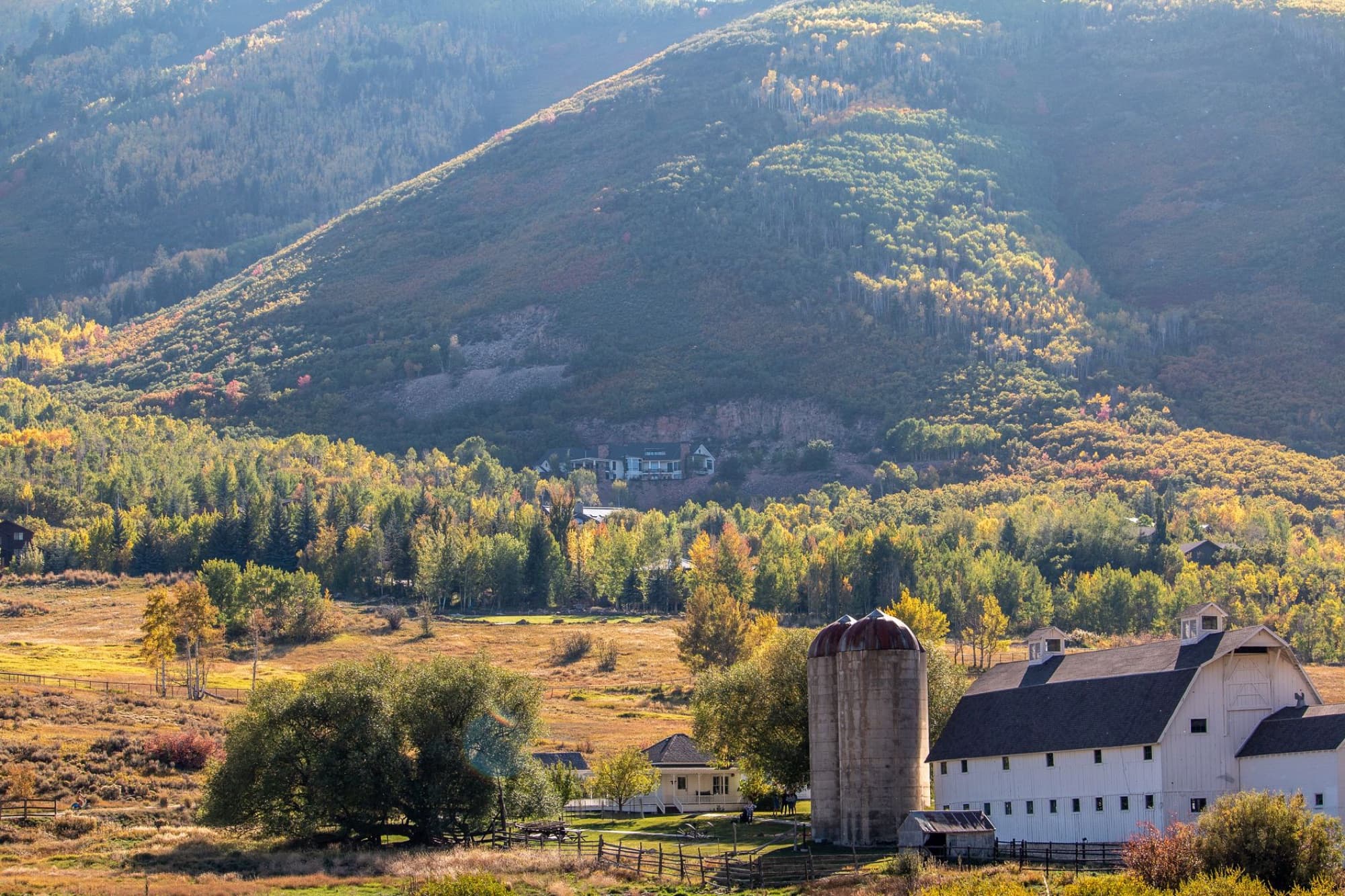 Scenic view of McPolin Barn amidst fall foliage in Park City, Utah.