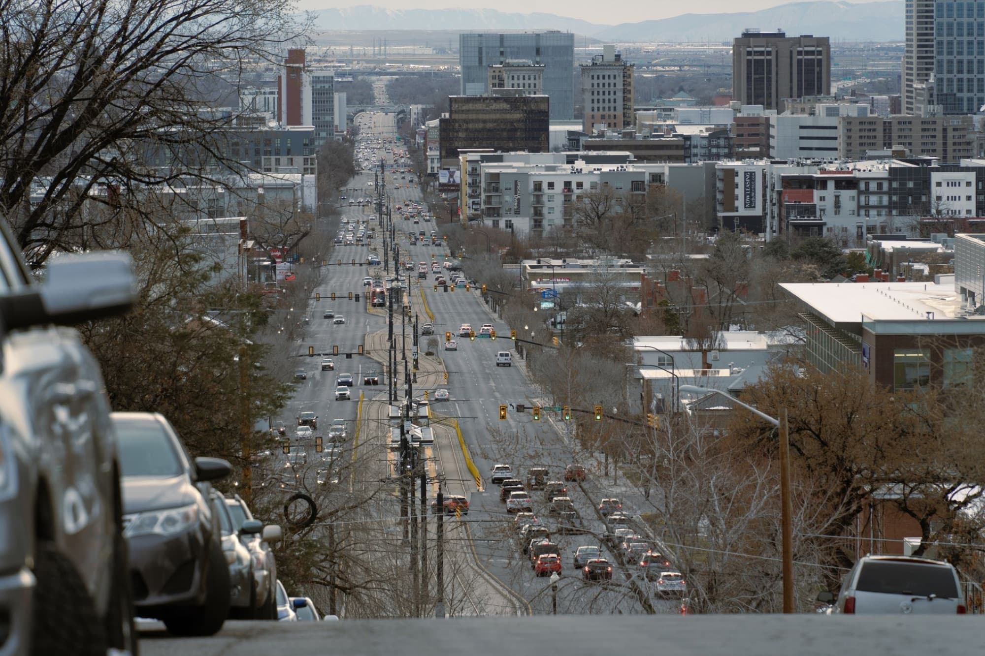 Aerial view of a bustling street in Salt Lake City, showcasing urban life and architecture.