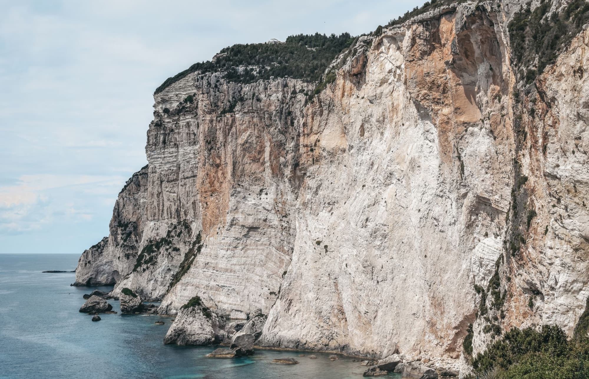 Stunning view of the steep cliffs along the Gaios coastline on Paxos Island, Greece.