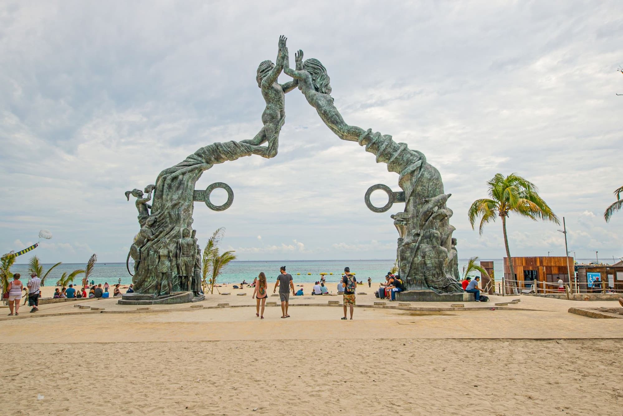 Stunning view of the Portal Maya sculpture on a sunny Playa del Carmen beach.