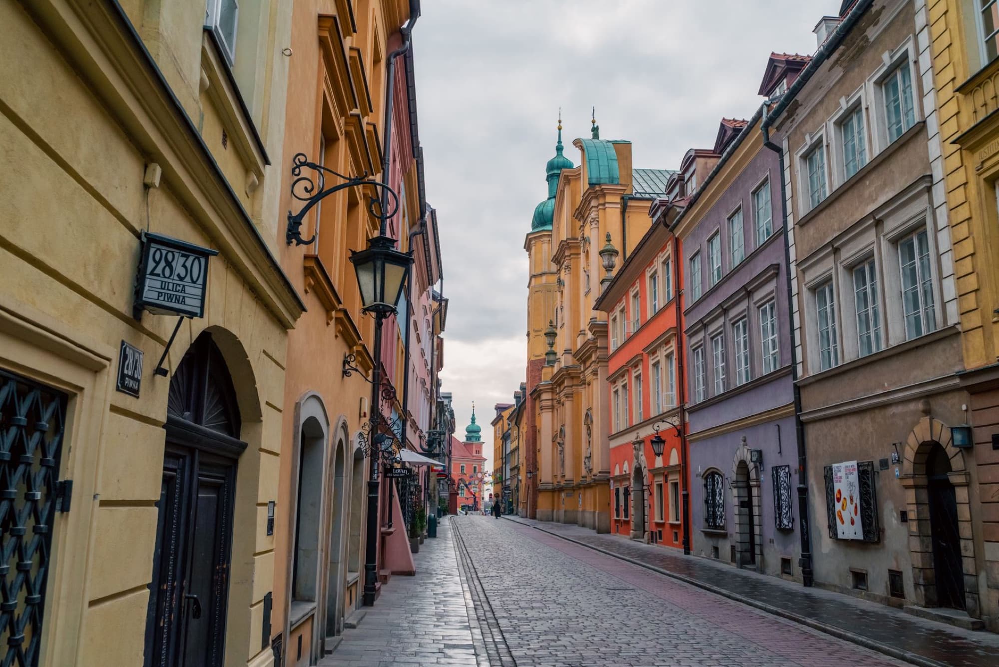 Colorful architecture of an old town street in Warsaw, Poland, showcasing European charm.