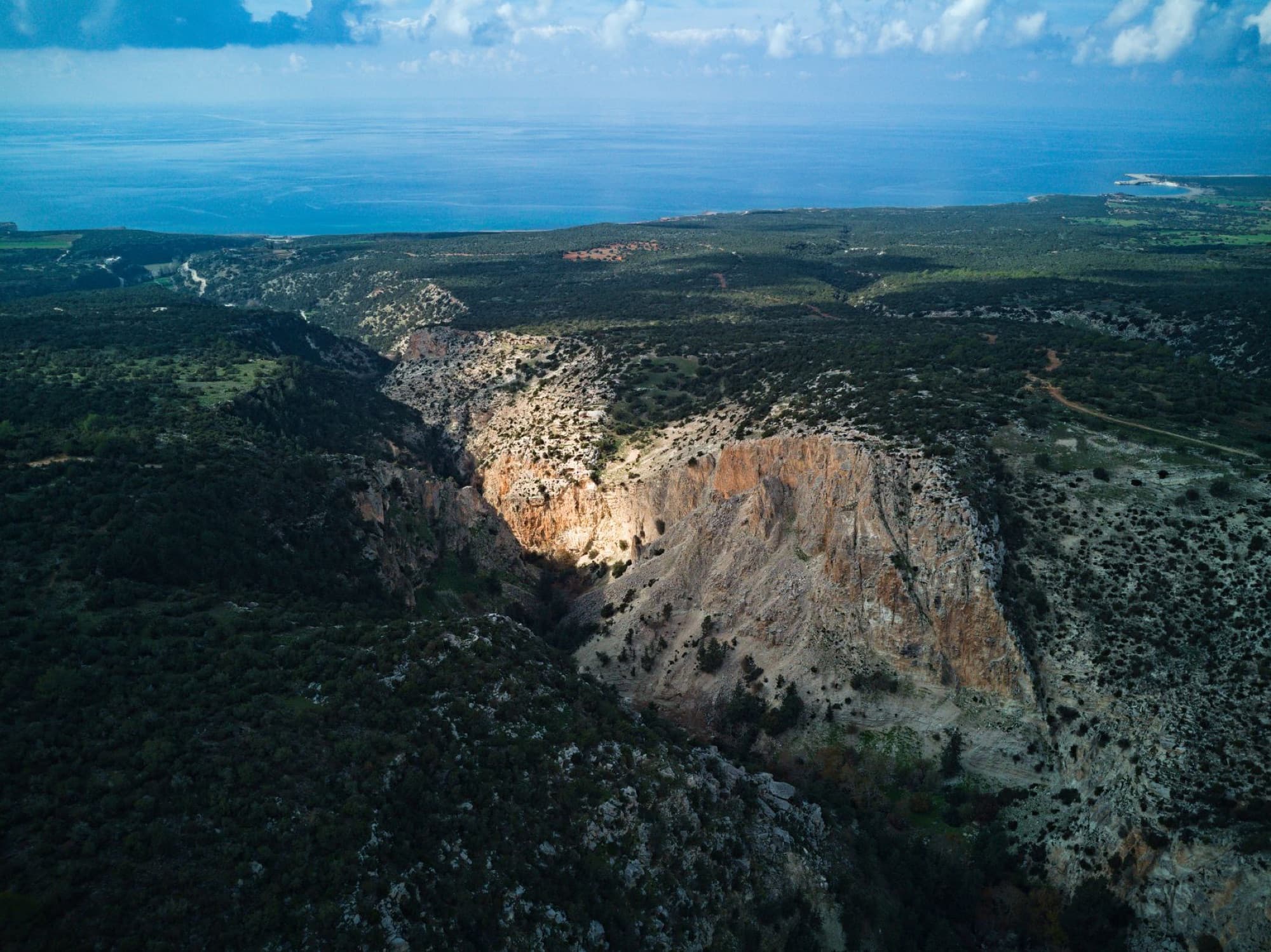 Stunning aerial landscape of Pafos coast and canyon in Cyprus, showcasing natural beauty.