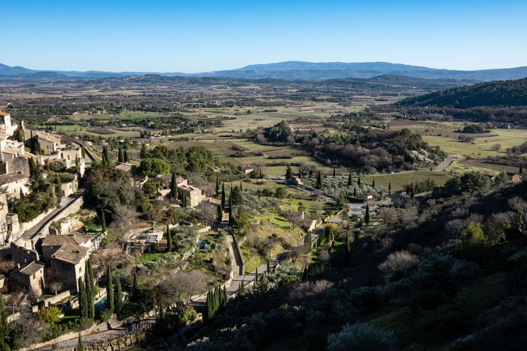 Aerial view of Gordes, a beautiful village in Provence, France with lush landscapes and historic architecture.