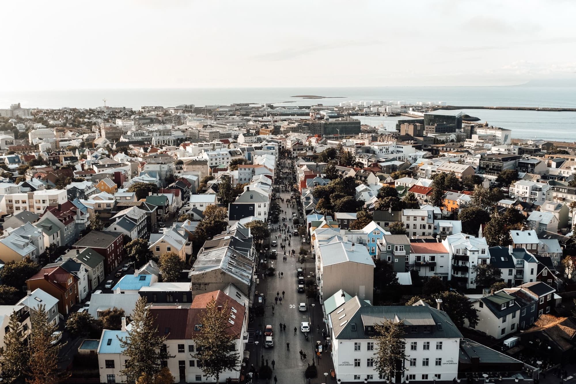 Stunning aerial view of Reykjavík showcasing colorful houses and the bustling urban landscape.