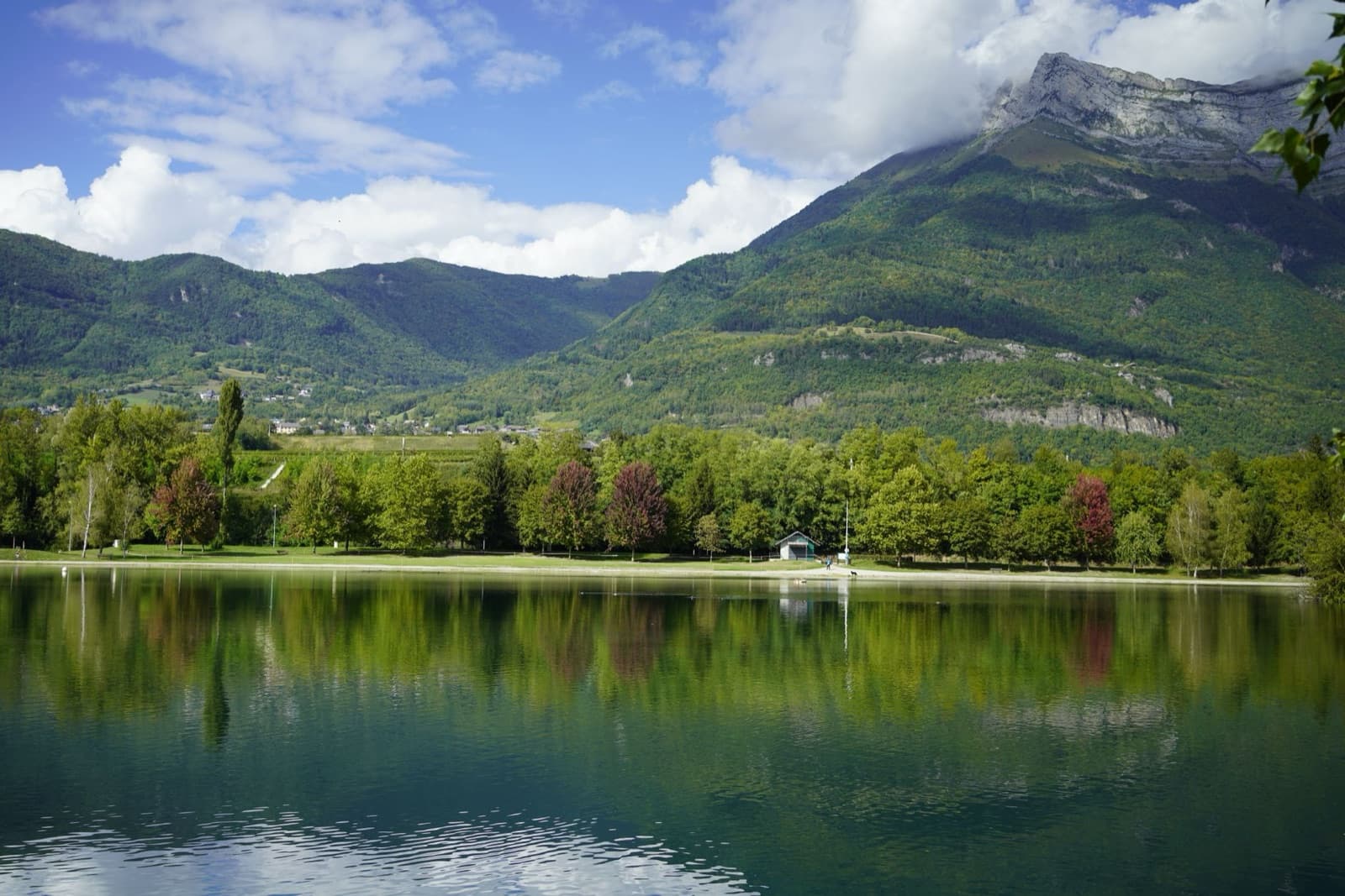 Picturesque lake with mountain view in Auvergne-Rhône-Alpes, France.