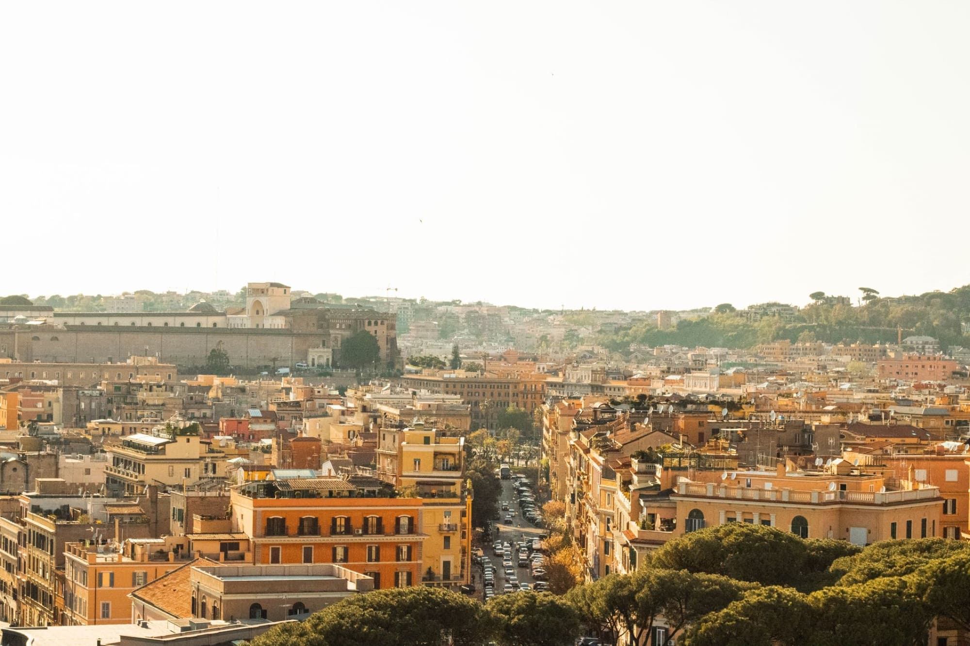 Aerial view of Rome showcasing historic architecture and vibrant urban landscape.