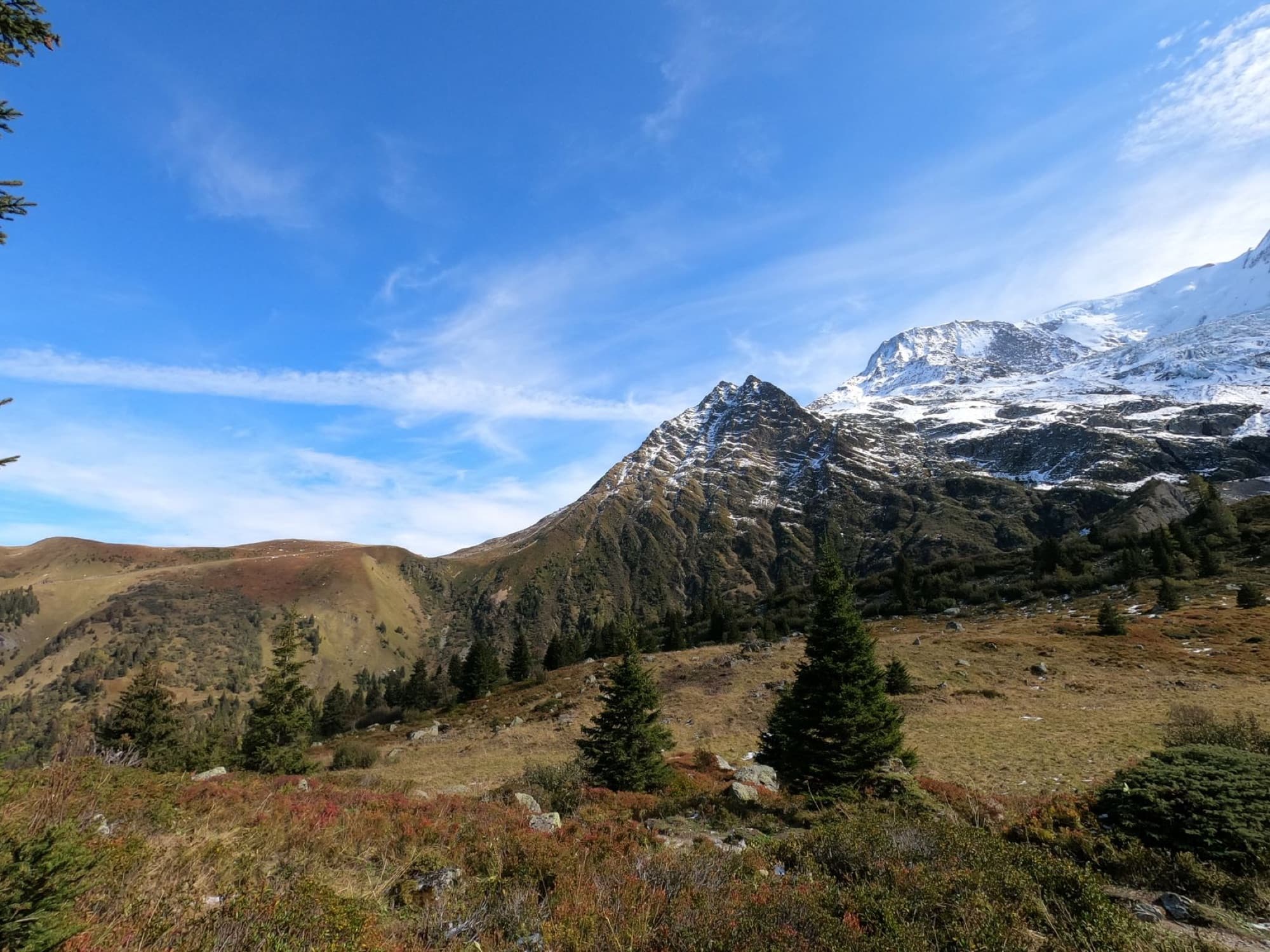 Breathtaking view of snow-capped mountains and lush greenery in Saint-Gervais-les-Bains.