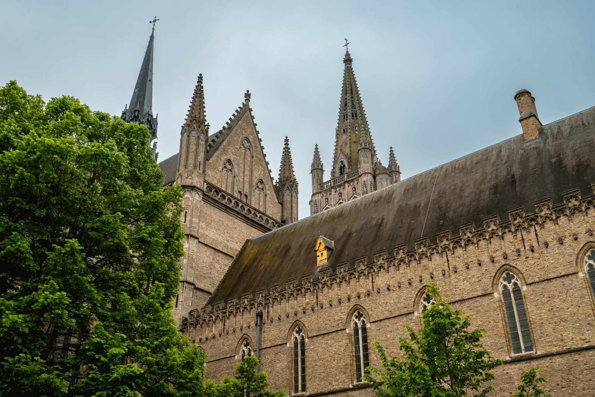 Explore the intricate Gothic spires and robust stonework of Saint Martin's Cathedral in Ieper, Belgium.