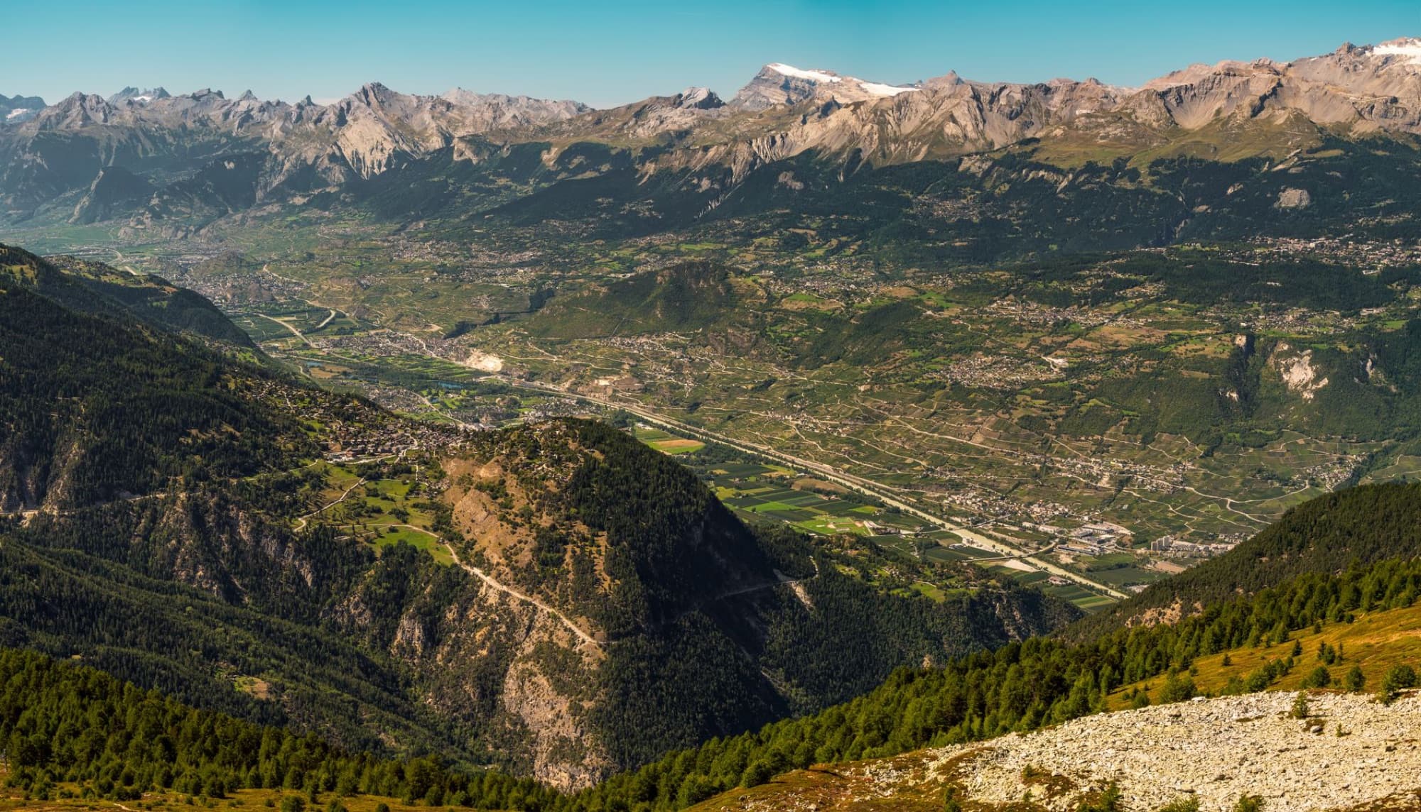 Panoramic aerial view of the Anniviers Valley in Wallis, Switzerland, showcasing stunning mountain landscapes.