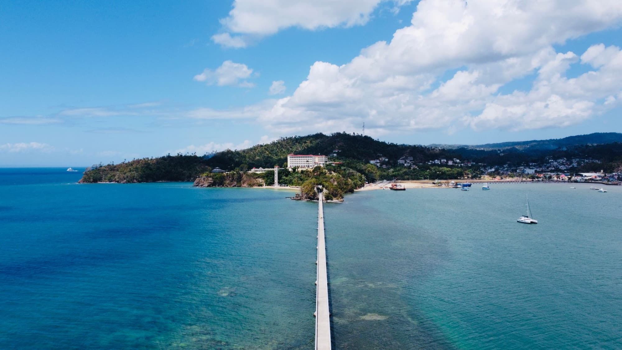Scenic aerial shot of Samana Bridge stretching across azure waters in Samana, Dominican Republic.