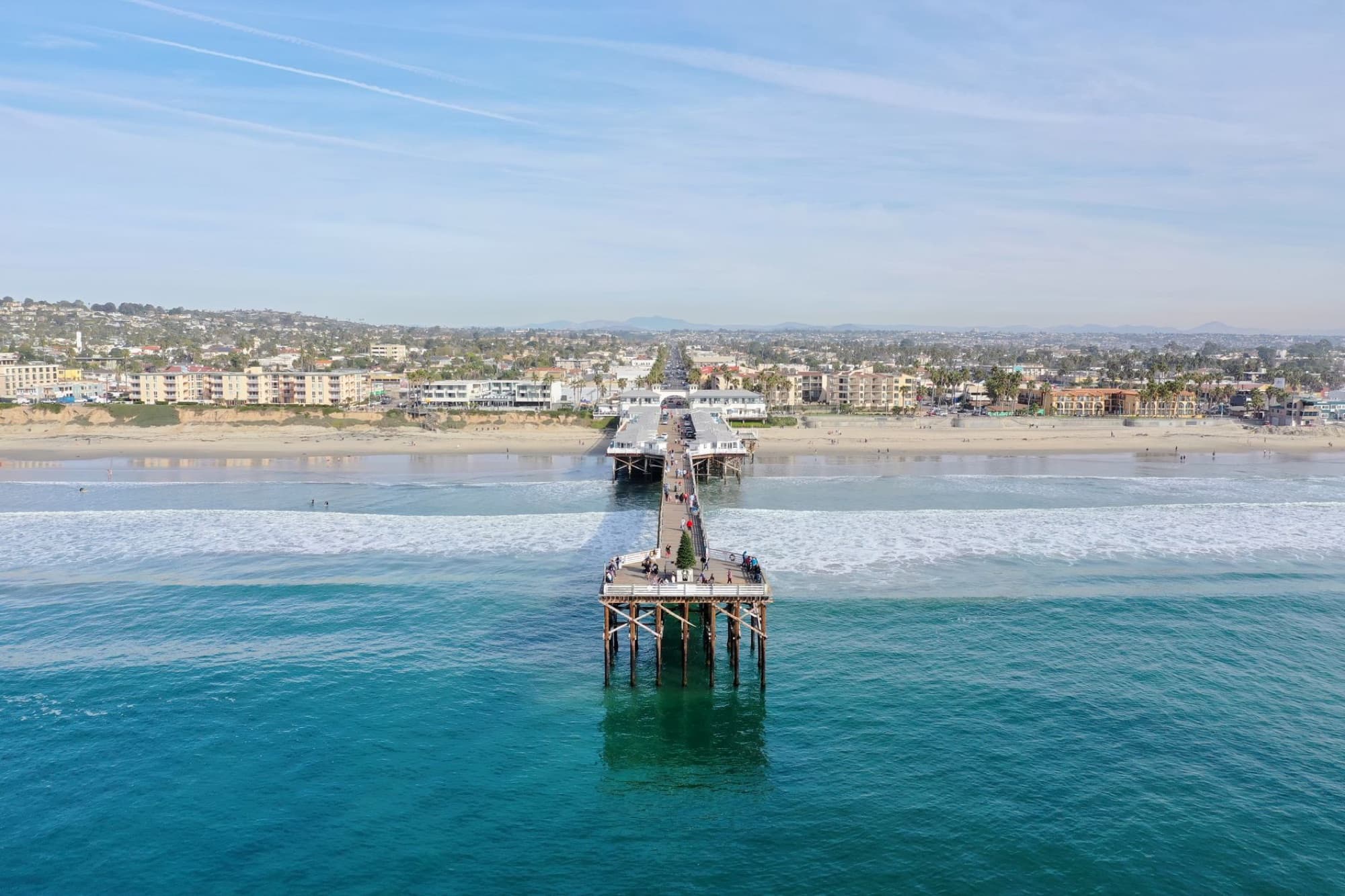 Stunning aerial view of Pacific Beach Pier overlooking the ocean and coastline in San Diego, California.