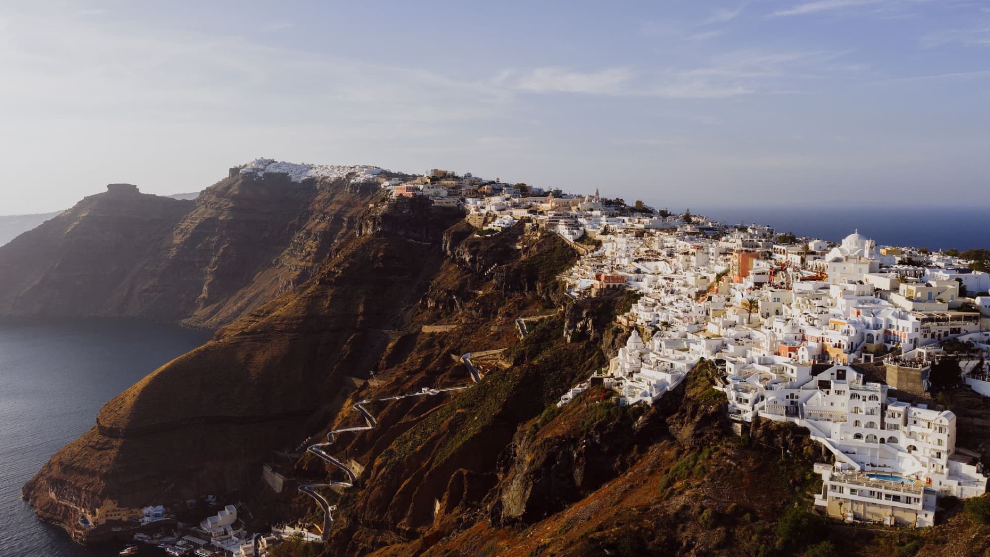 A stunning aerial view of Fira's iconic white buildings on Santorini's cliffs.