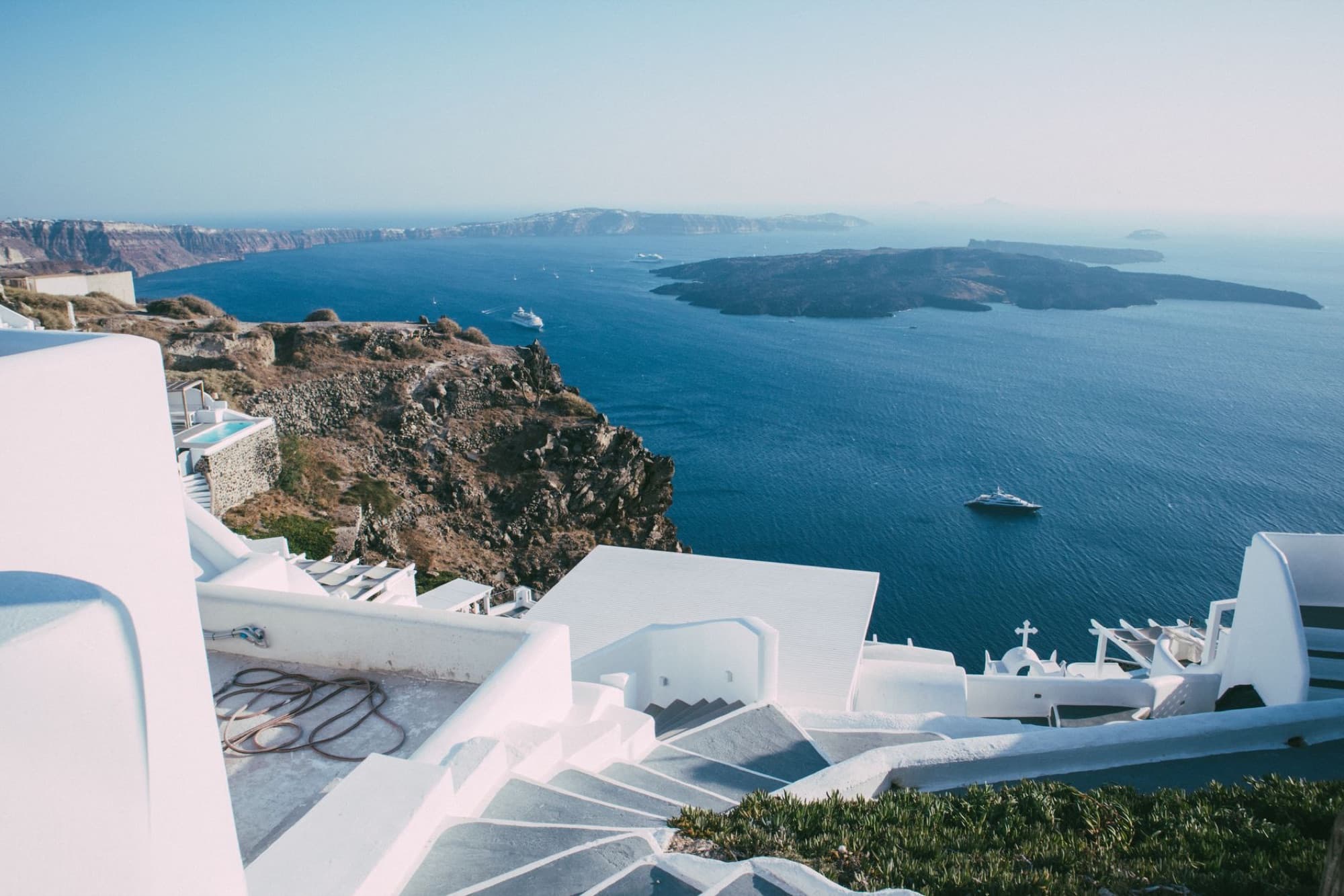 Stunning aerial view of Santorini's white architecture and blue sea.
