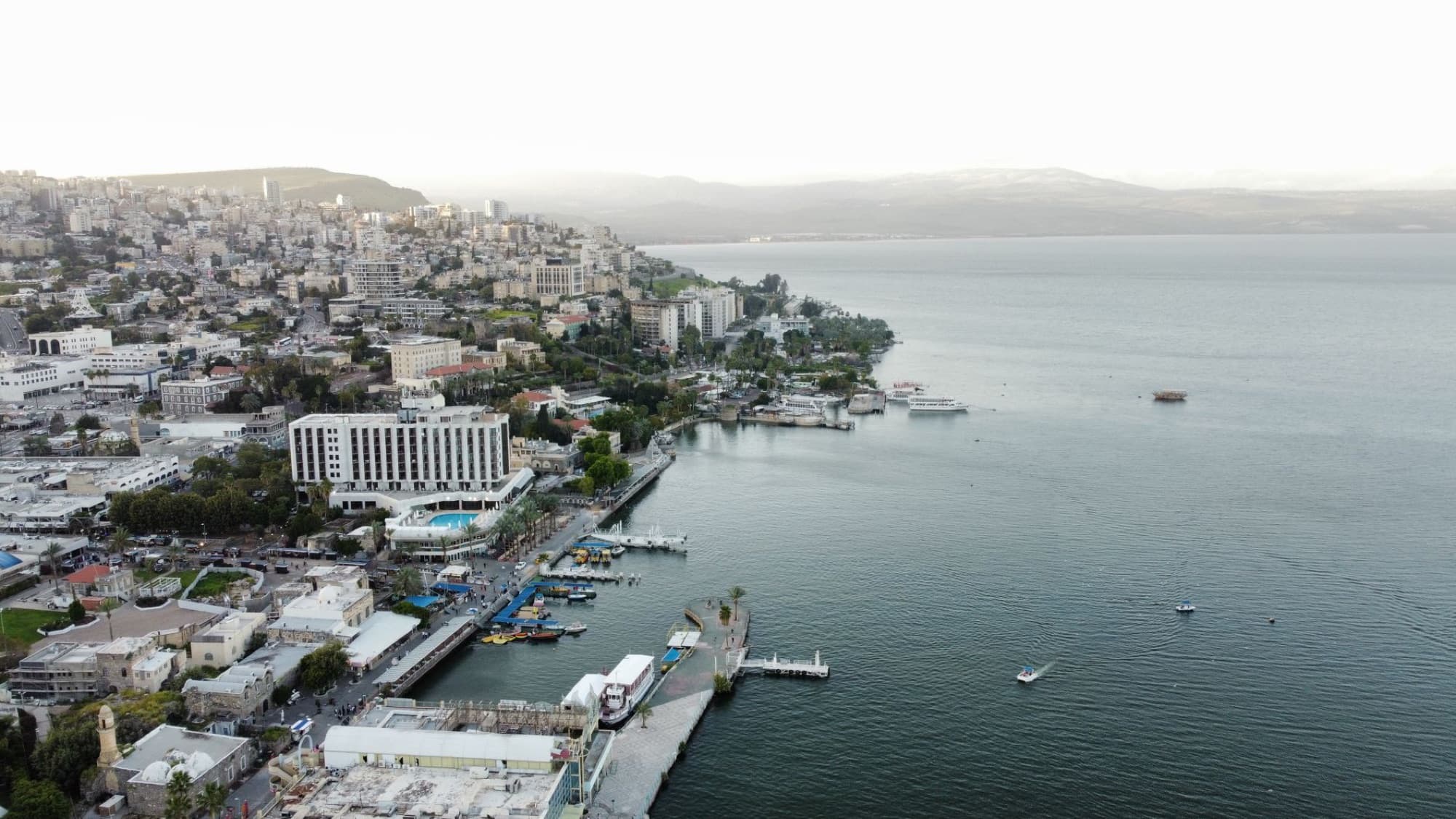 A breathtaking aerial view of Tiberias, Israel, showcasing the cityscape and Sea of Galilee coastline.