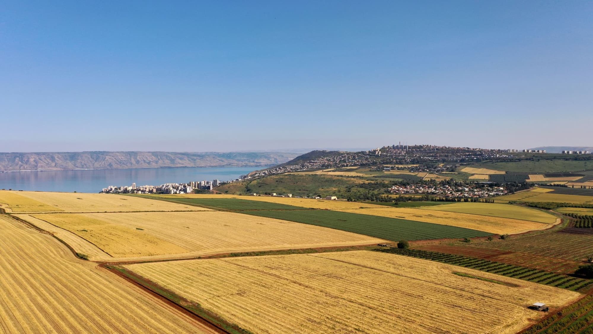 Stunning aerial view of agricultural fields near Arbel and the Sea of Galilee in Israel.