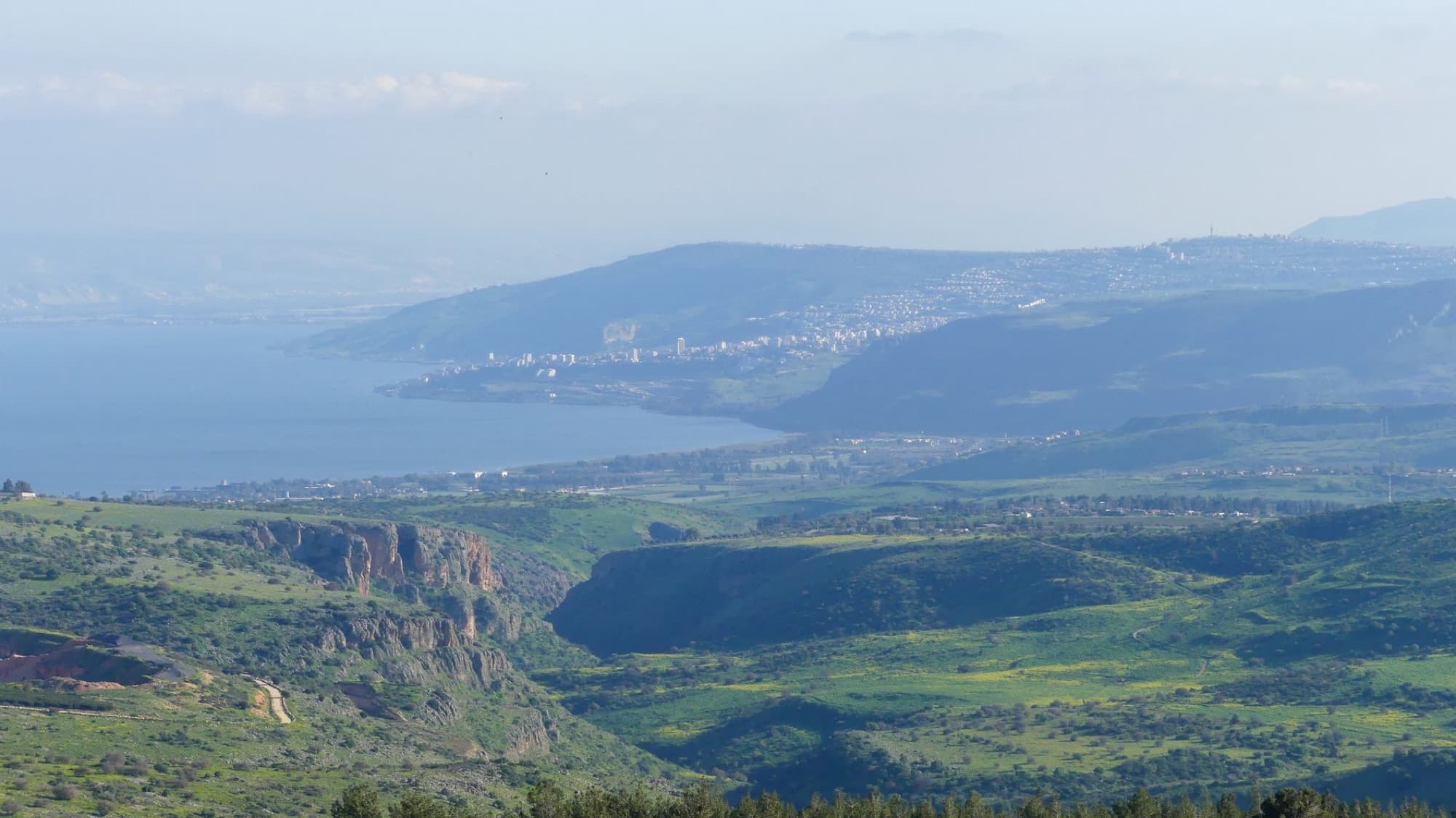 A breathtaking landscape of the lush green hills and Sea of Galilee in Israel.