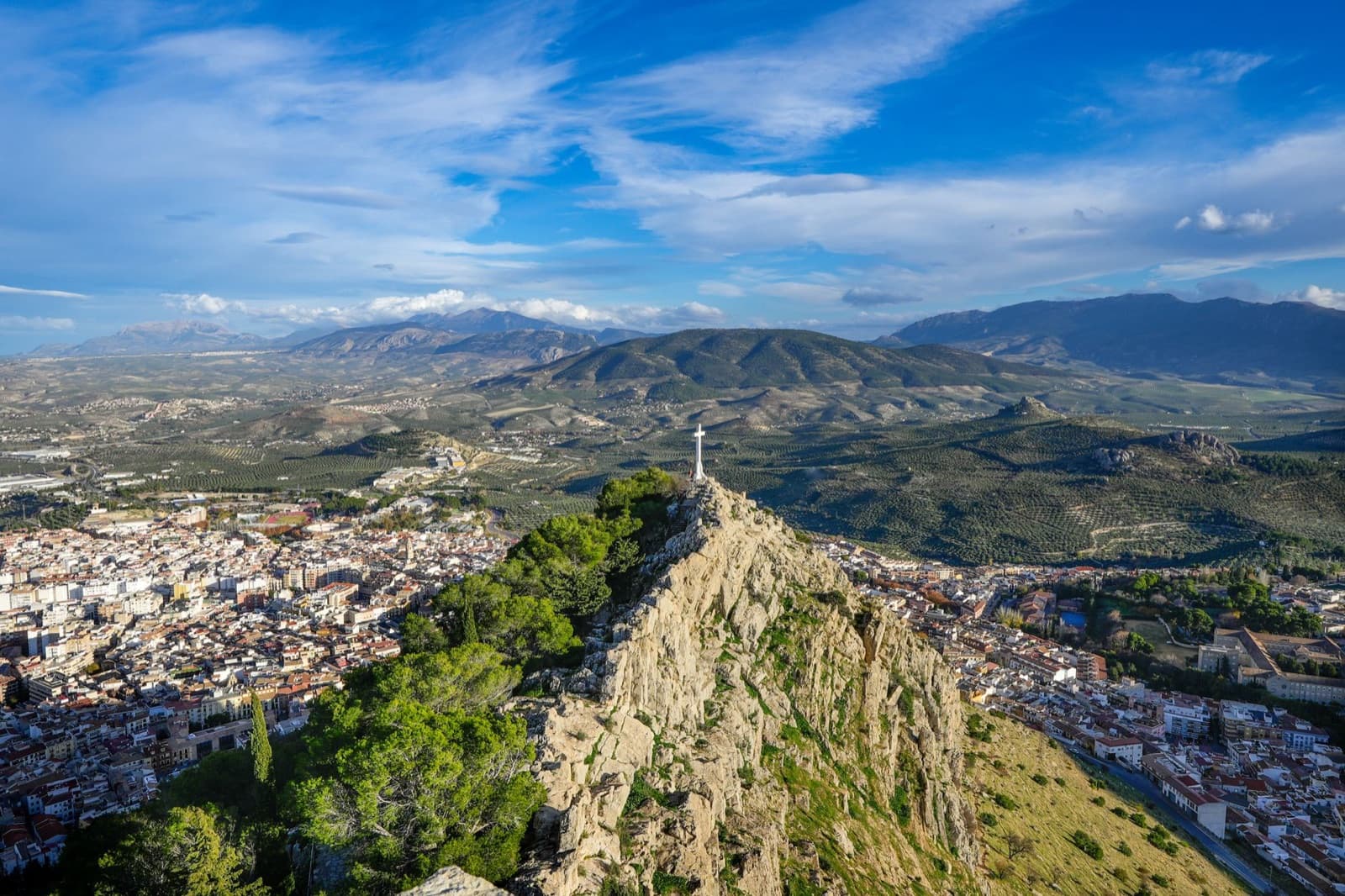 Aerial view of Jaén City with Santa Catalina Castle, surrounded by picturesque Andalucian landscape.