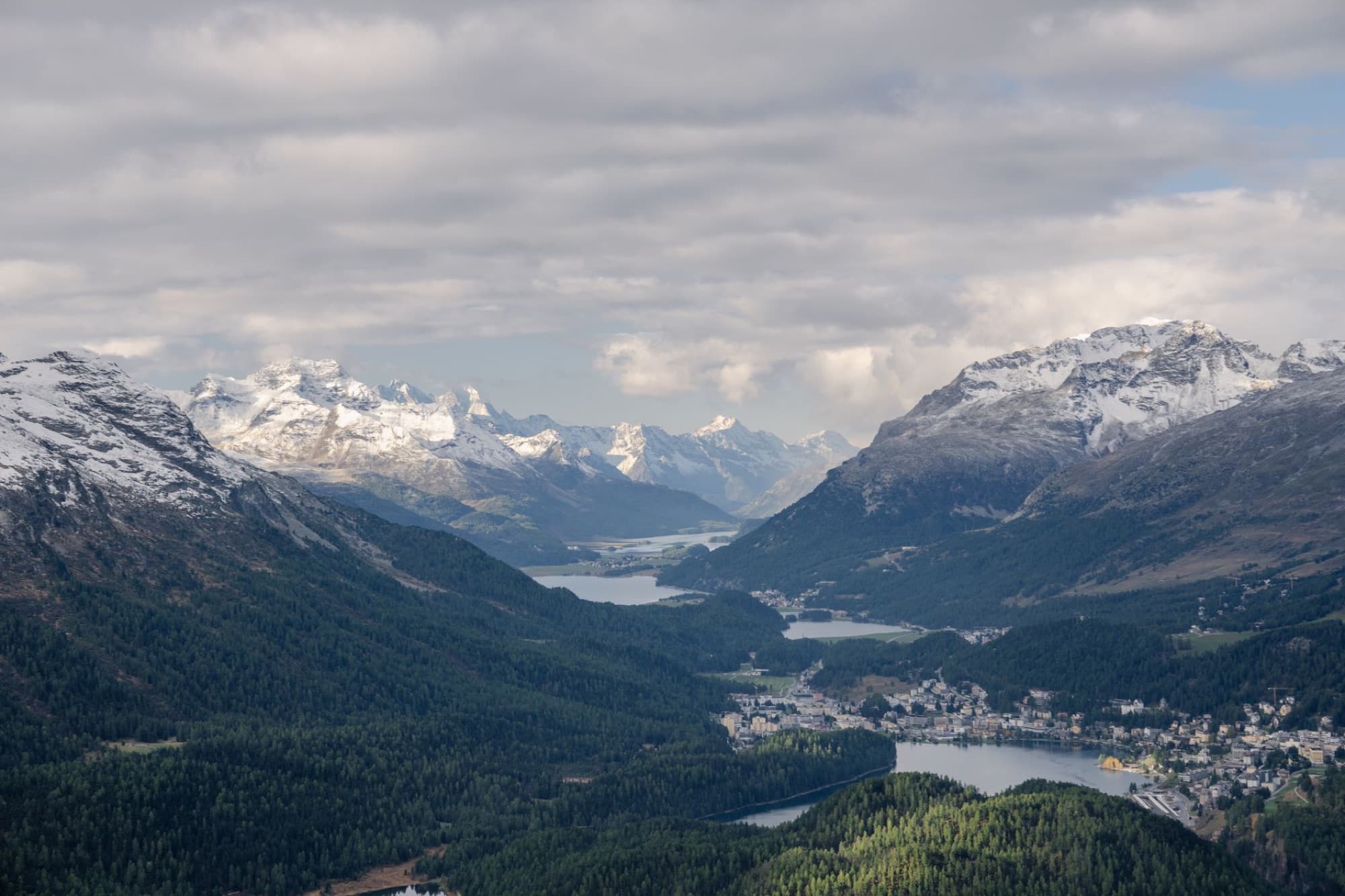 A stunning aerial view of the Swiss Alps and St. Moritz valley, captured in Graubünden, Switzerland.