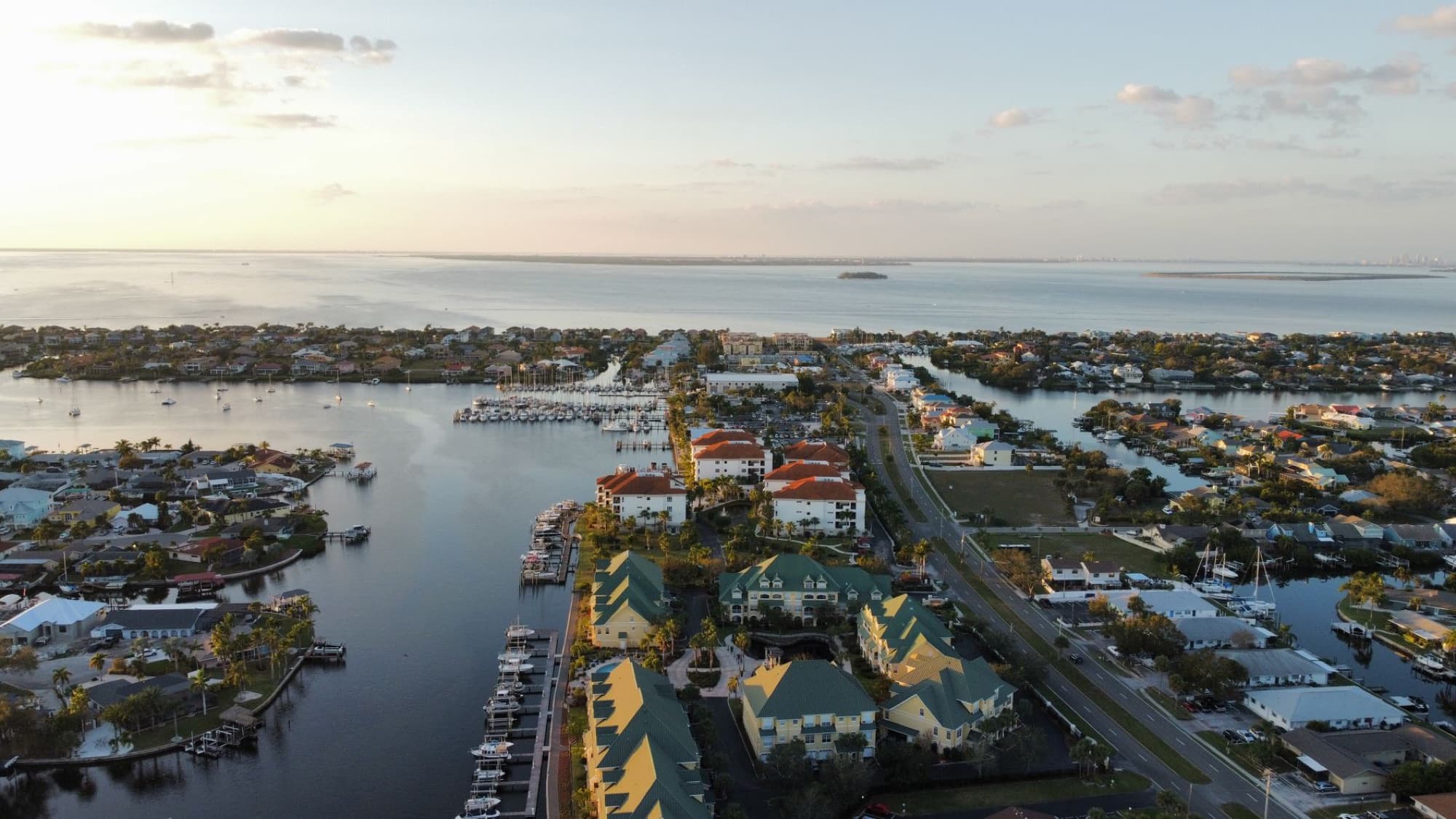 Aerial view of Apollo Beach, FL showcasing the waterfront community and marina at sunset.
