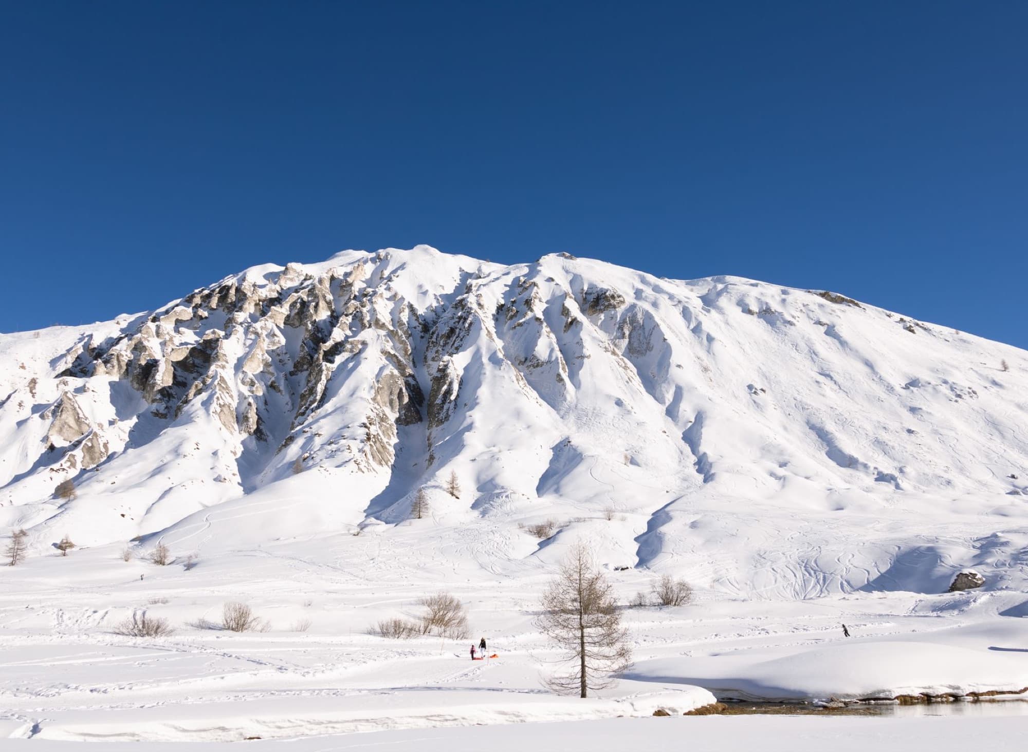 Scenic view of a snow-covered mountain in Tignes, France during winter.
