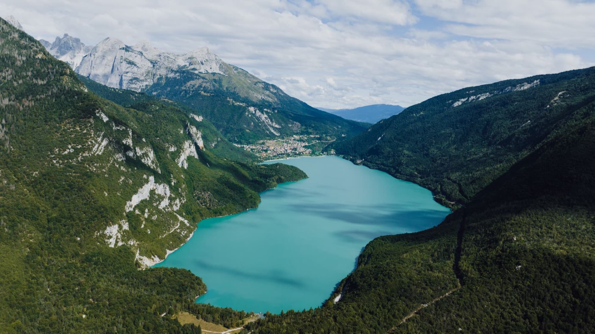 A breathtaking aerial view of Lake Molveno surrounded by the Italian Alps, Trentino-Alto Adige.