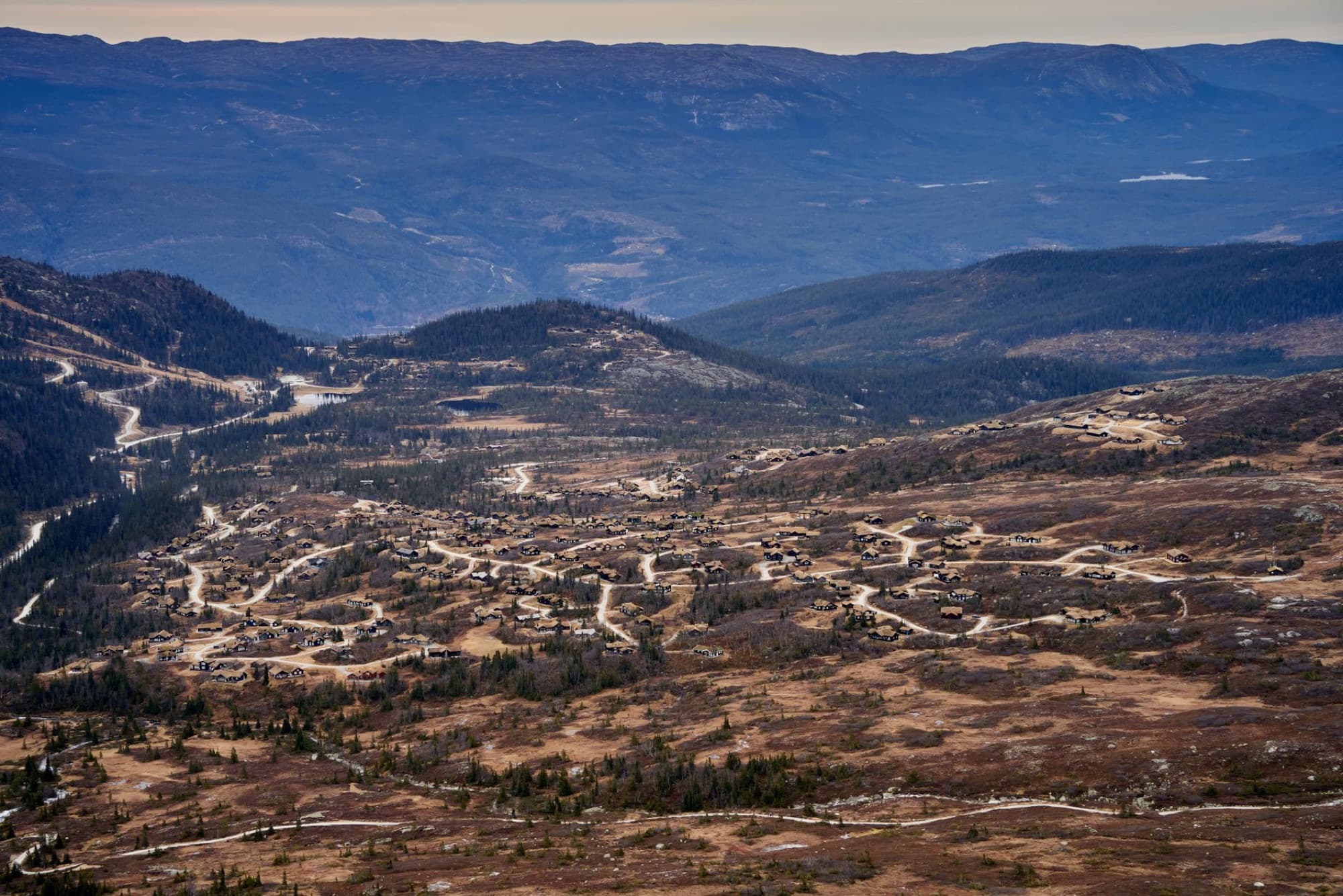 Aerial view of a picturesque mountain village in Buskerud, Norway during autumn.
