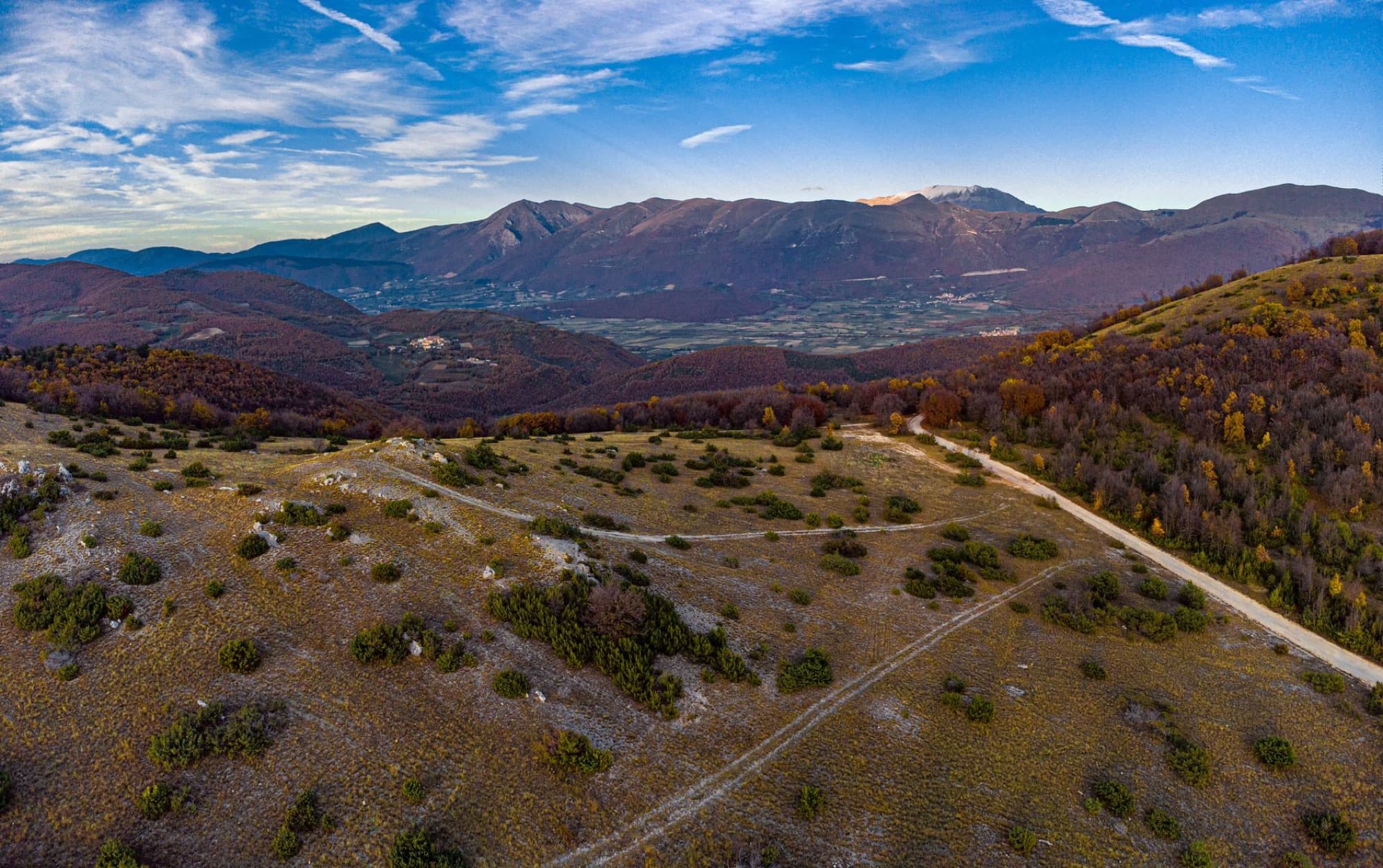 A stunning aerial view capturing the autumnal landscape of Cascia, Umbria, Italy.