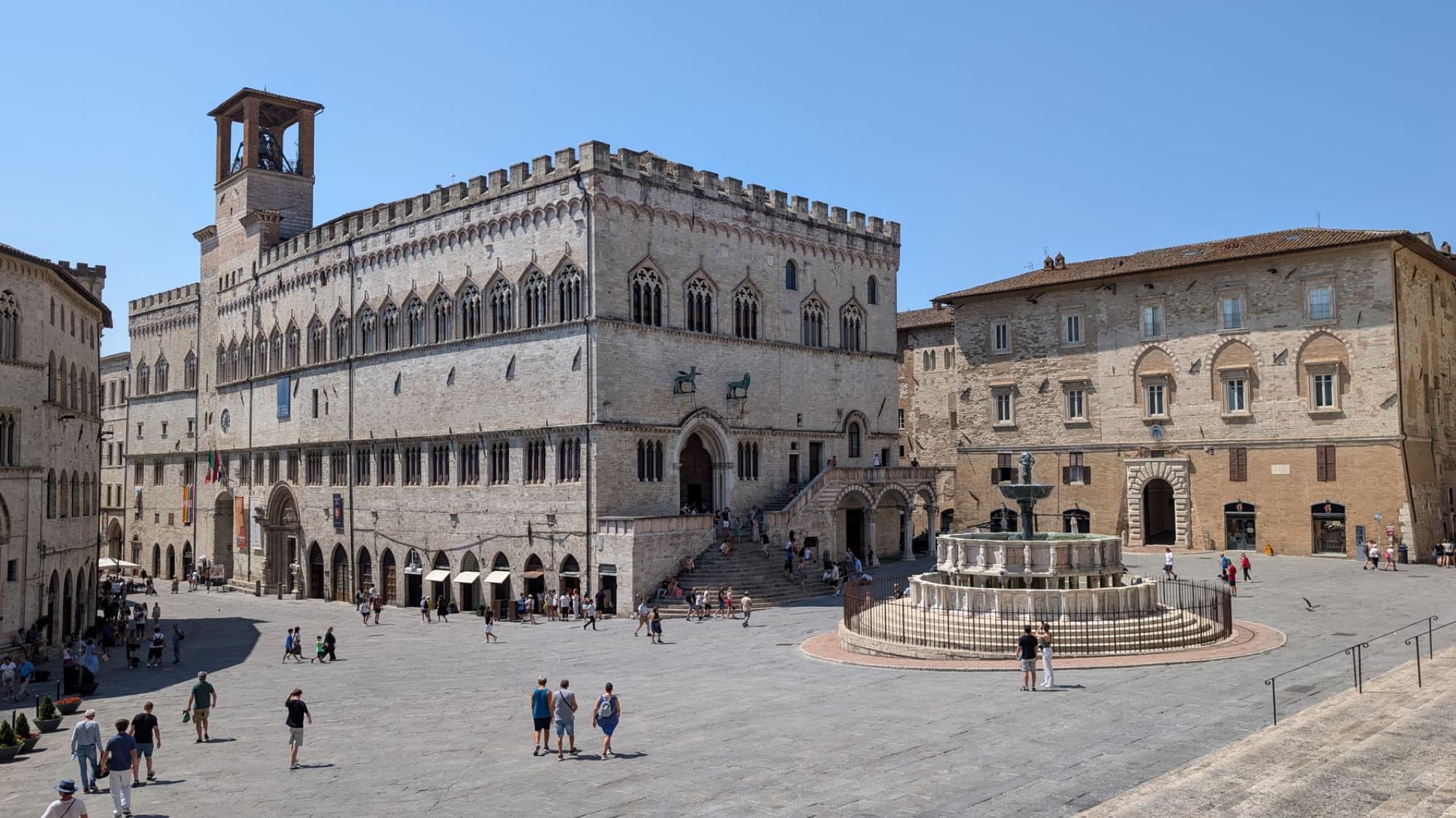 Explore the stunning medieval architecture of Perugia, Umbria with a view of the Palazzo dei Priori and Fontana Maggiore.