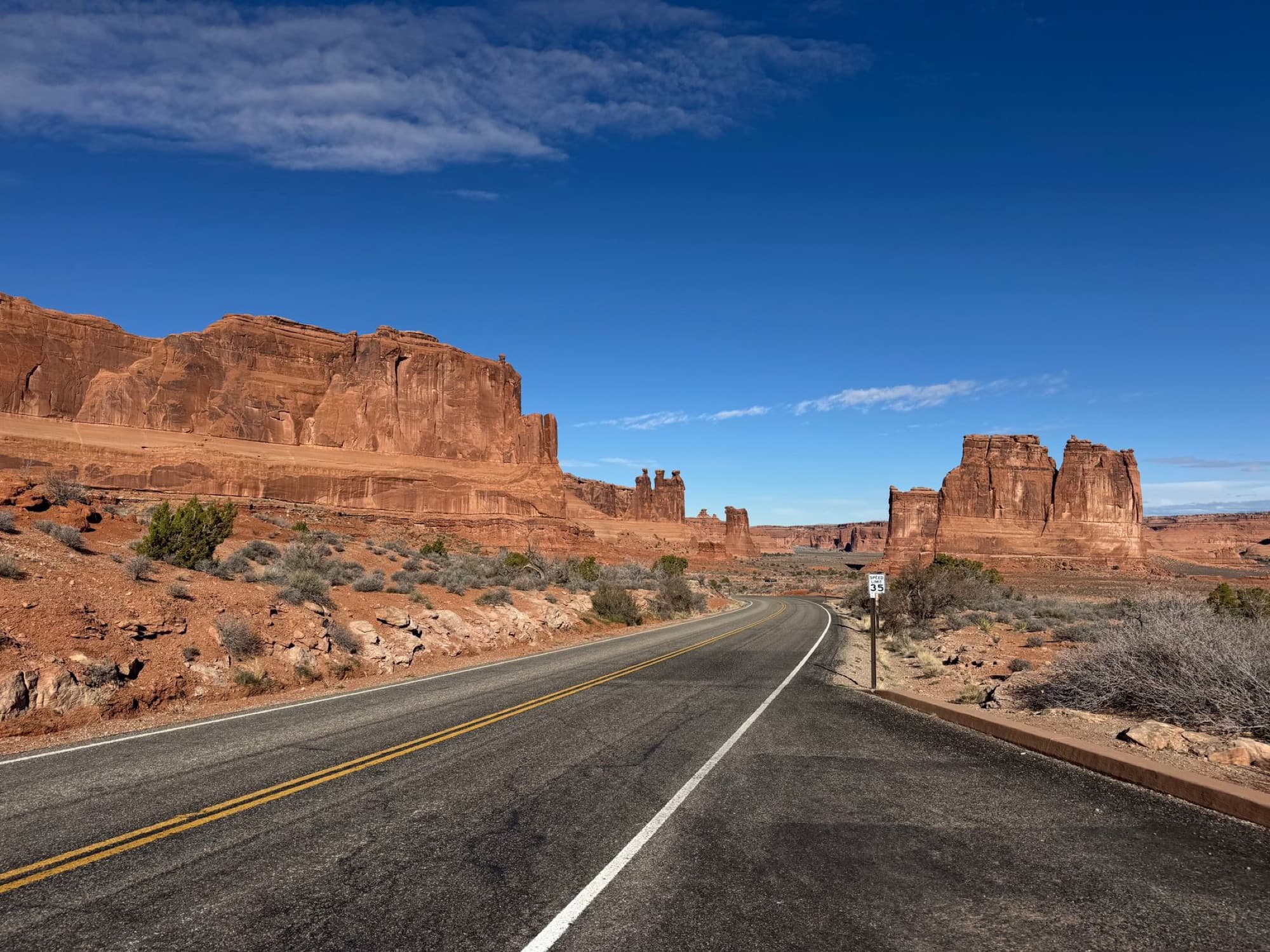 Discover the breathtaking red rock formations along the scenic road of Arches National Park, Utah.