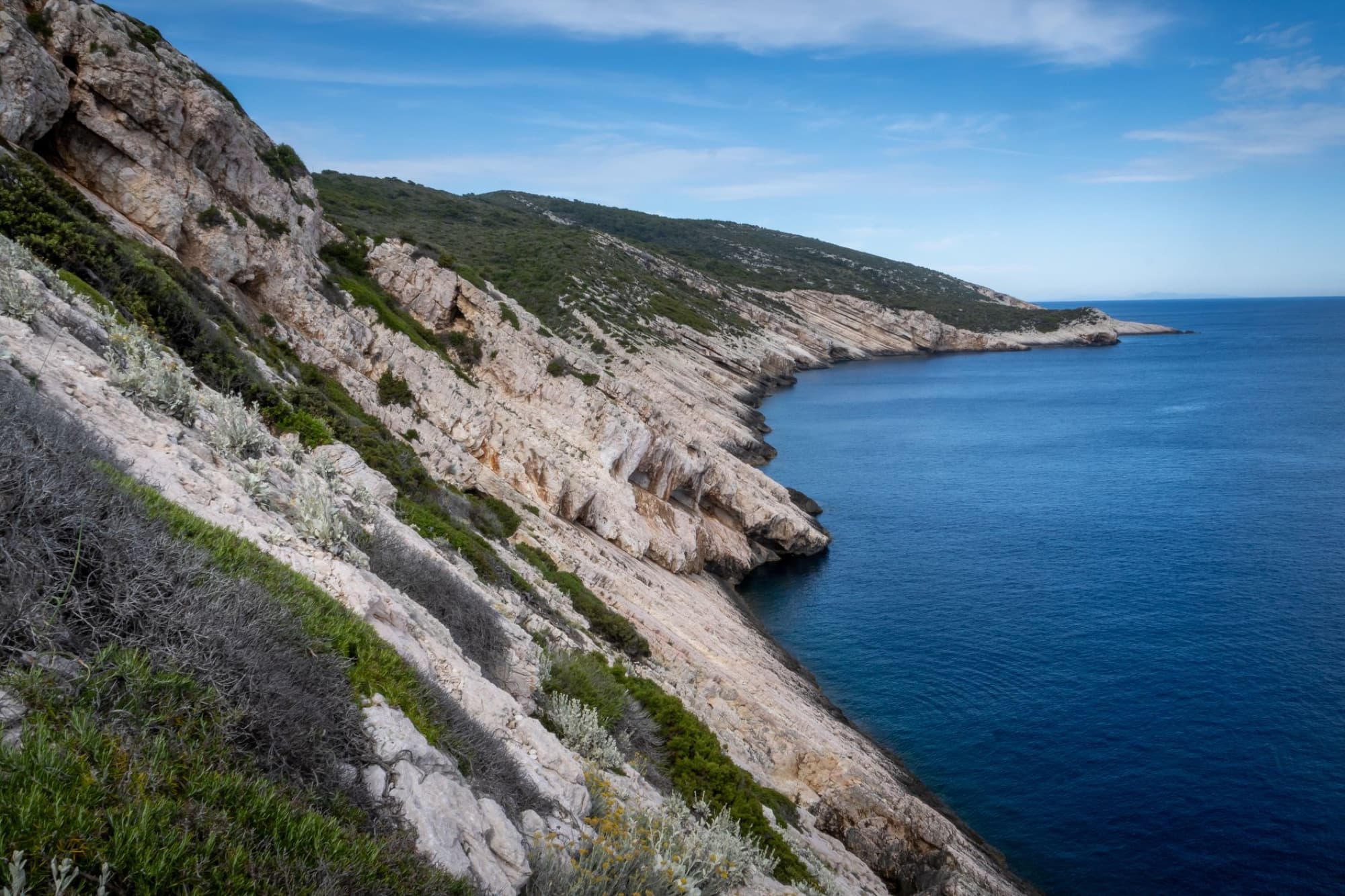 Experience the stunning rocky coastline of Vis Island with azure blue waters.