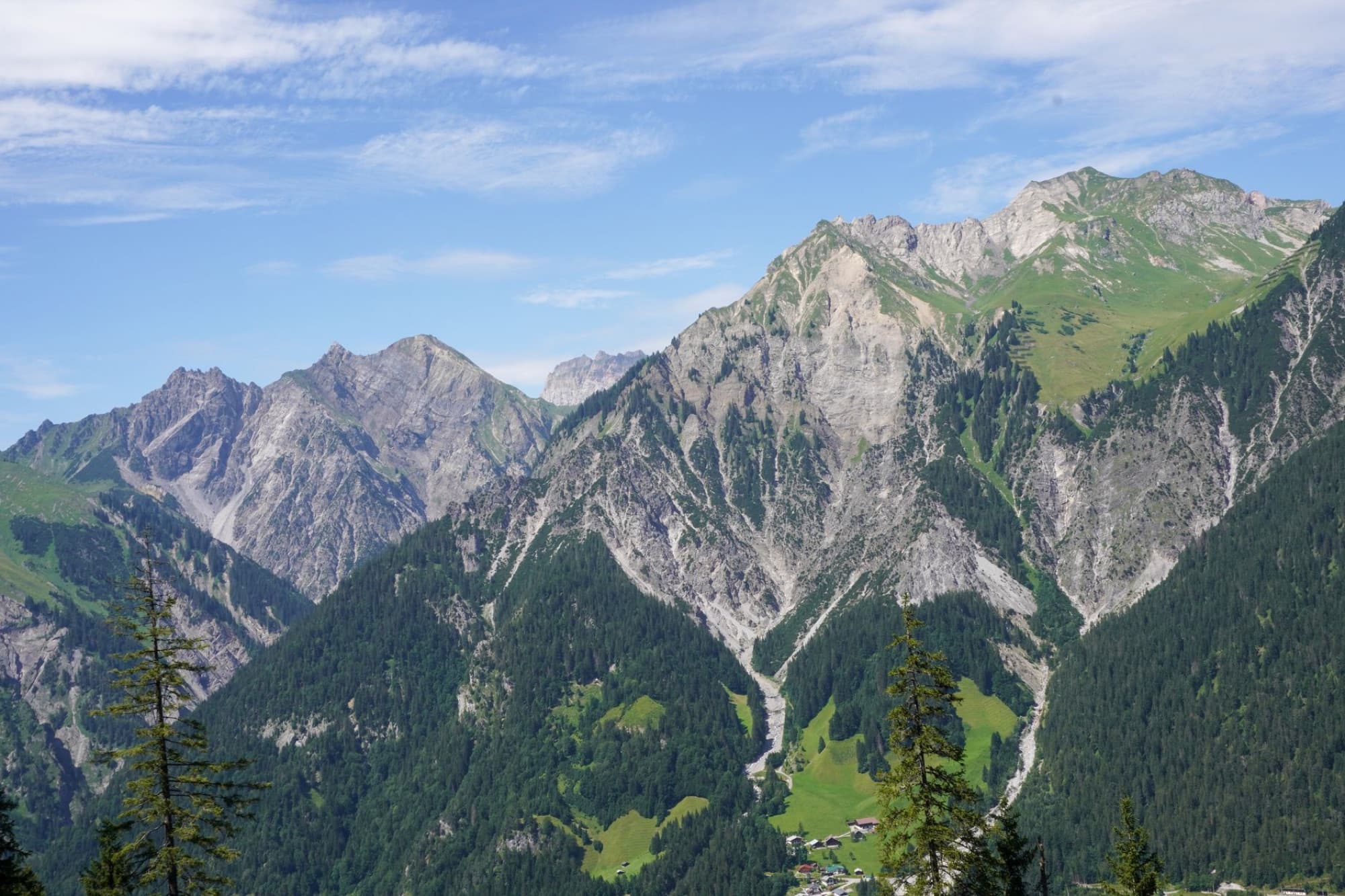 Scenic summer view of Silbertal mountains in Vorarlberg, Austria with clear blue sky.
