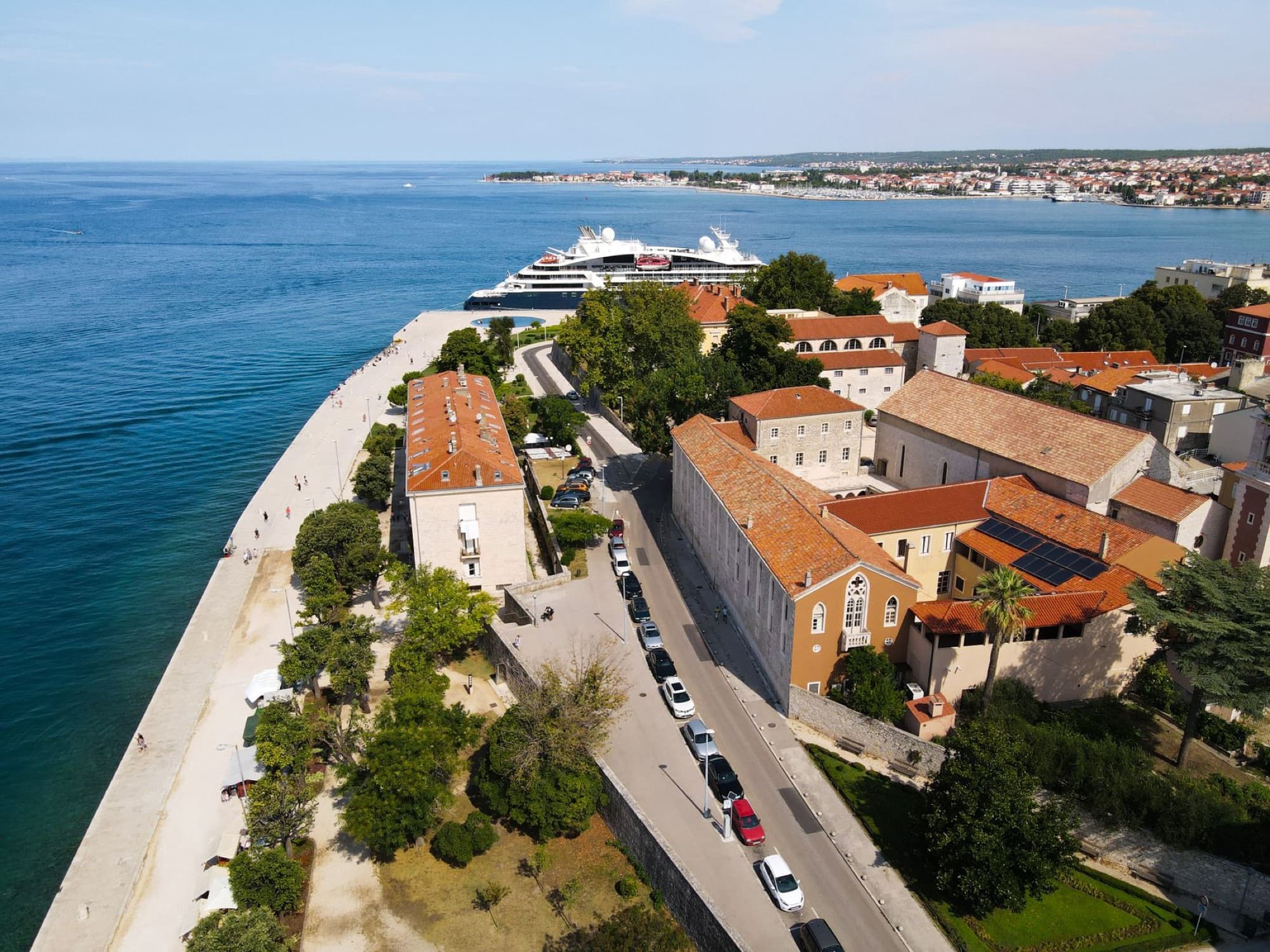 Drone shot capturing the coastal architecture of Zadar, Croatia overlooking the Adriatic Sea.