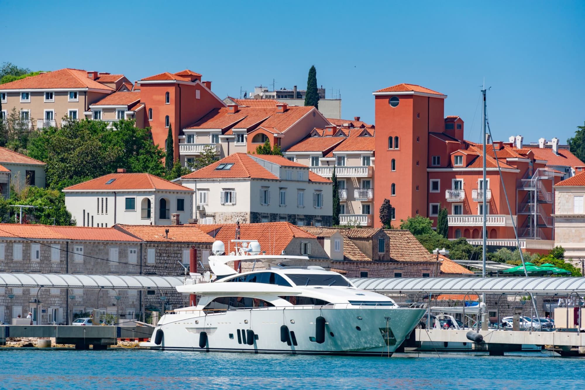 Stunning view of a modern yacht docked at Zadar harbor in Croatia's summer sun.