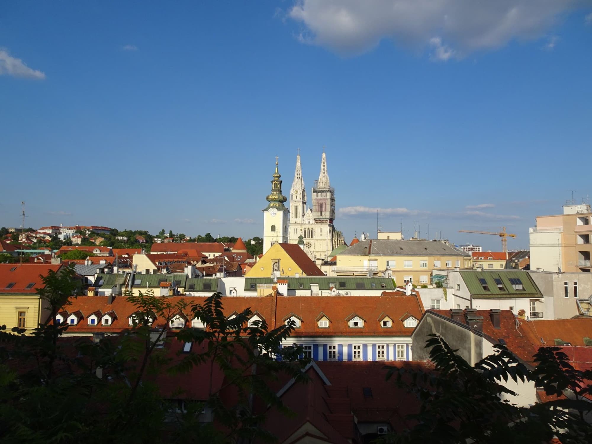 Charming view of Zagreb's skyline highlighting the iconic Cathedral under a bright summer sky.