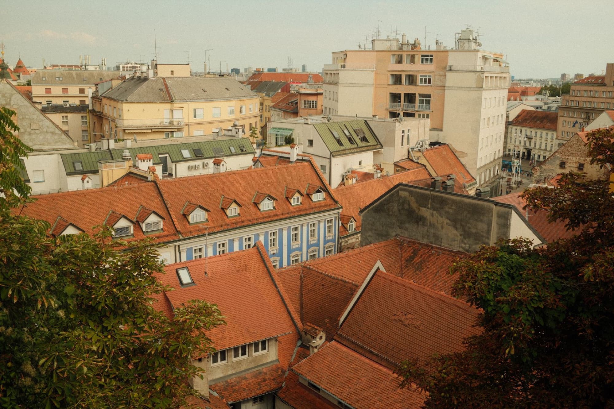 Capture the essence of Zagreb with a stunning view of traditional red-tile rooftops and historic buildings.
