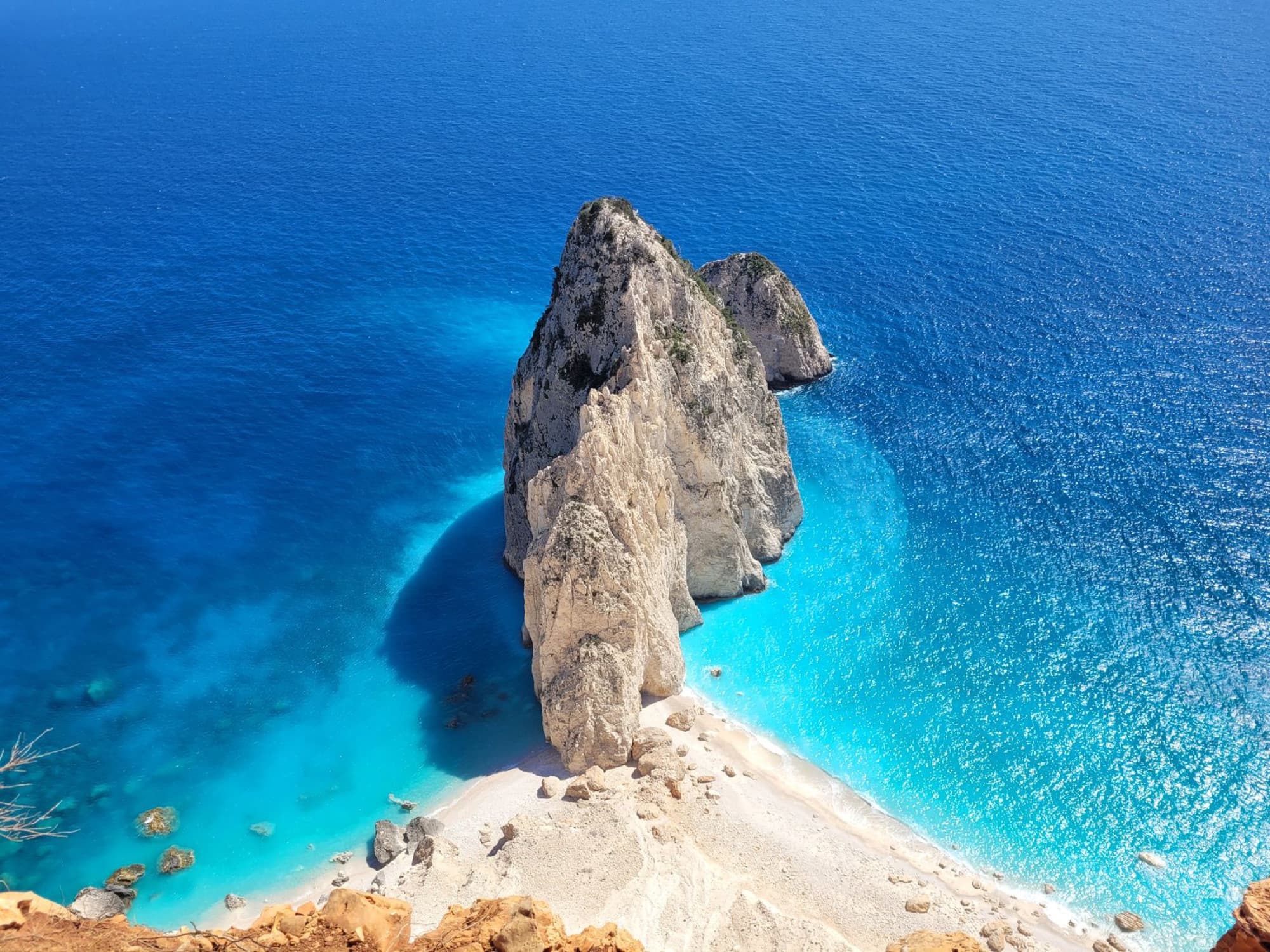 Stunning aerial view of the Mizithres sea stacks and azure waters in Zakynthos, Greece.