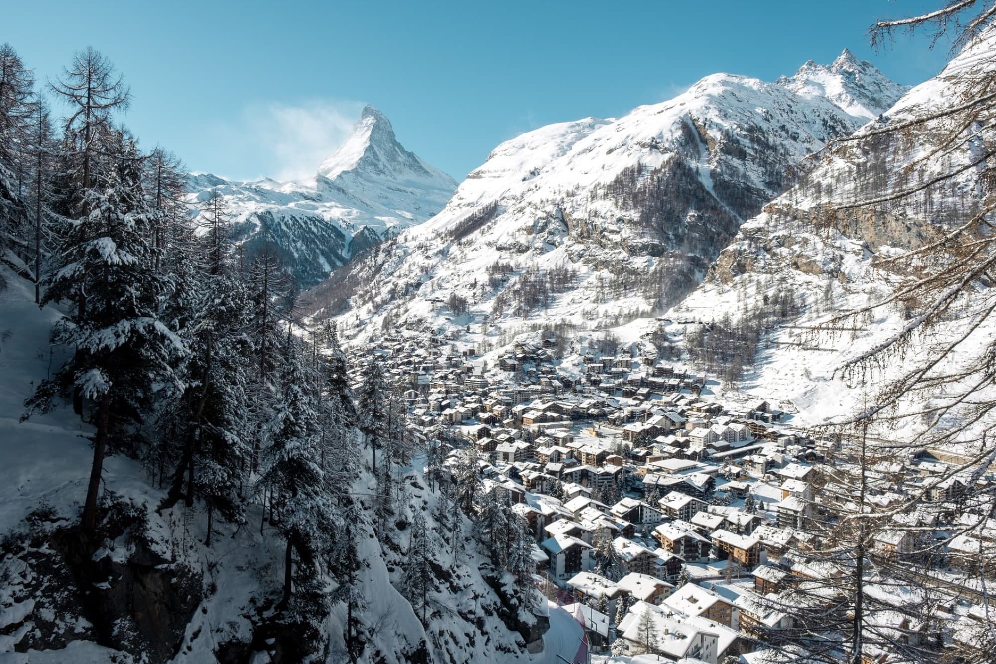 Scenic aerial view of Zermatt, Switzerland with the Matterhorn in the background during winter.